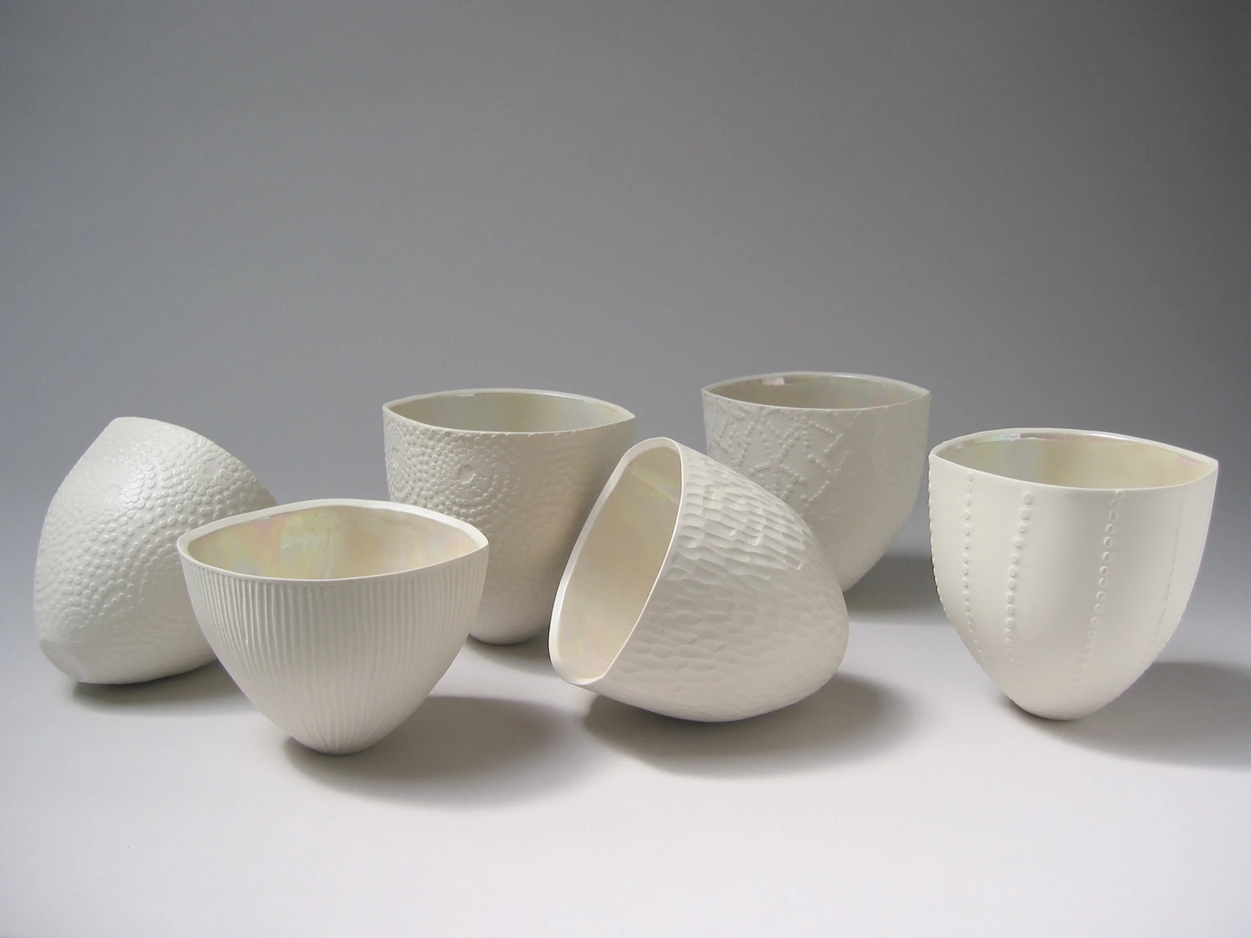 Bowls, Slip-cast semi-porcelain, water-etched, Height 10-12cm