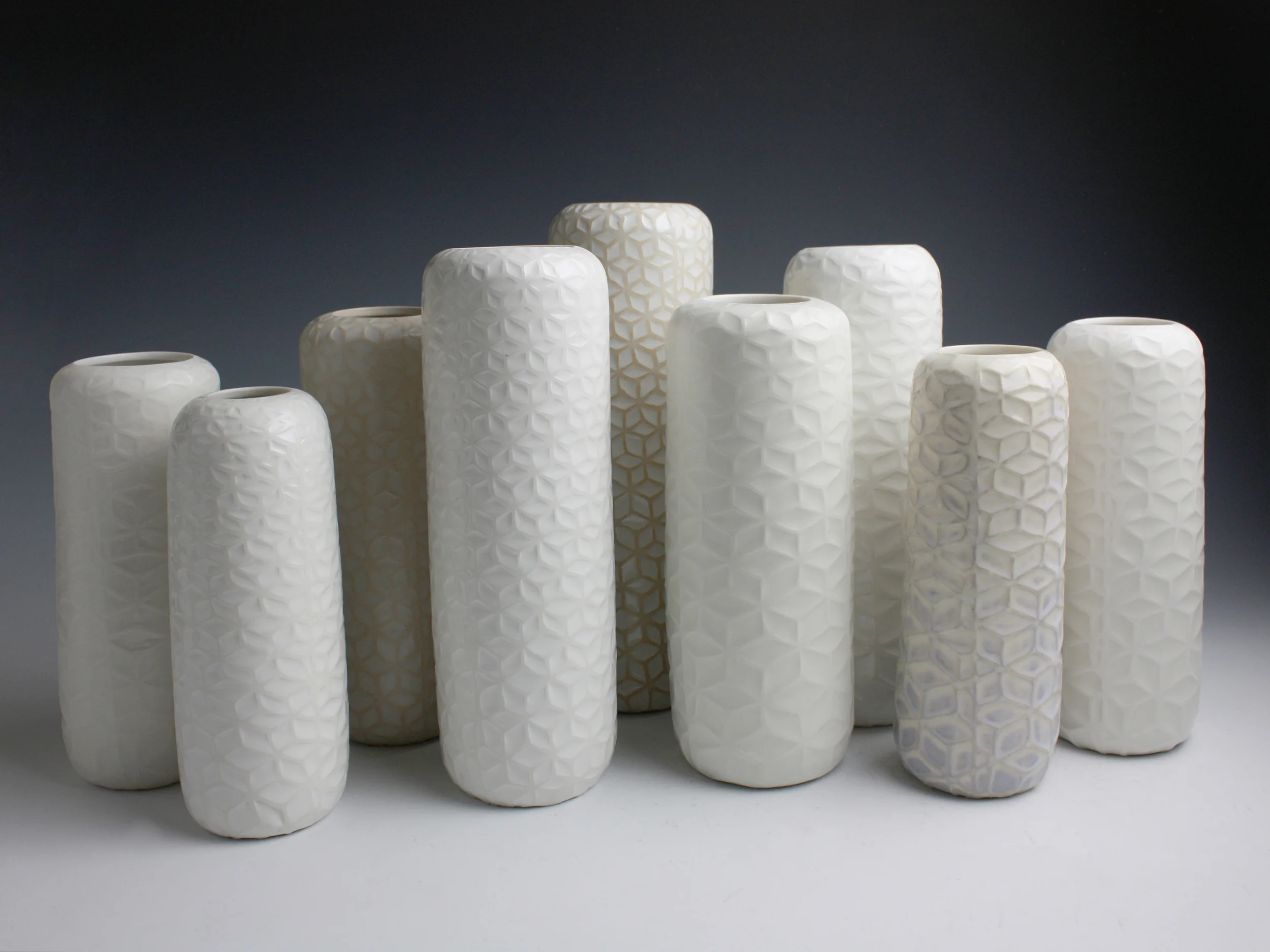 Drift, 2010. Thrown and water-etched porcelain. Set of 9, Height 28.5cm
