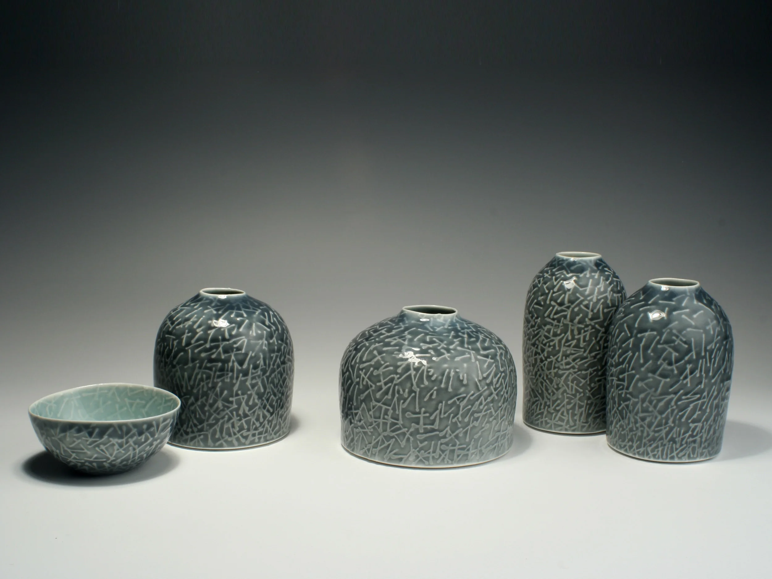 Still life of 4 Flasks and a Bowl, 2008. Thrown and water-etched porcelain