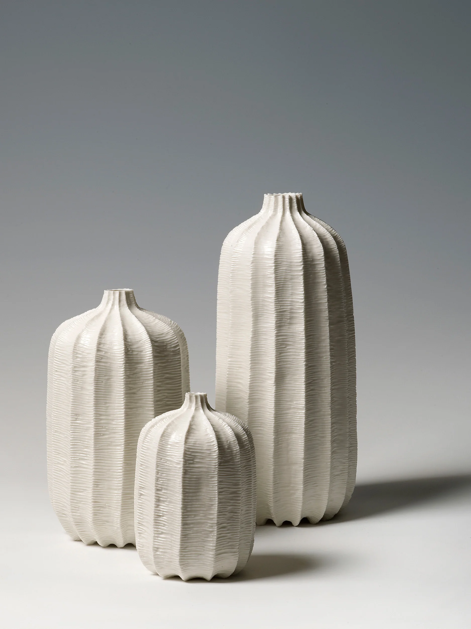 Three Pod Vases, 2012. Thrown and carved porcelain, height 31cm