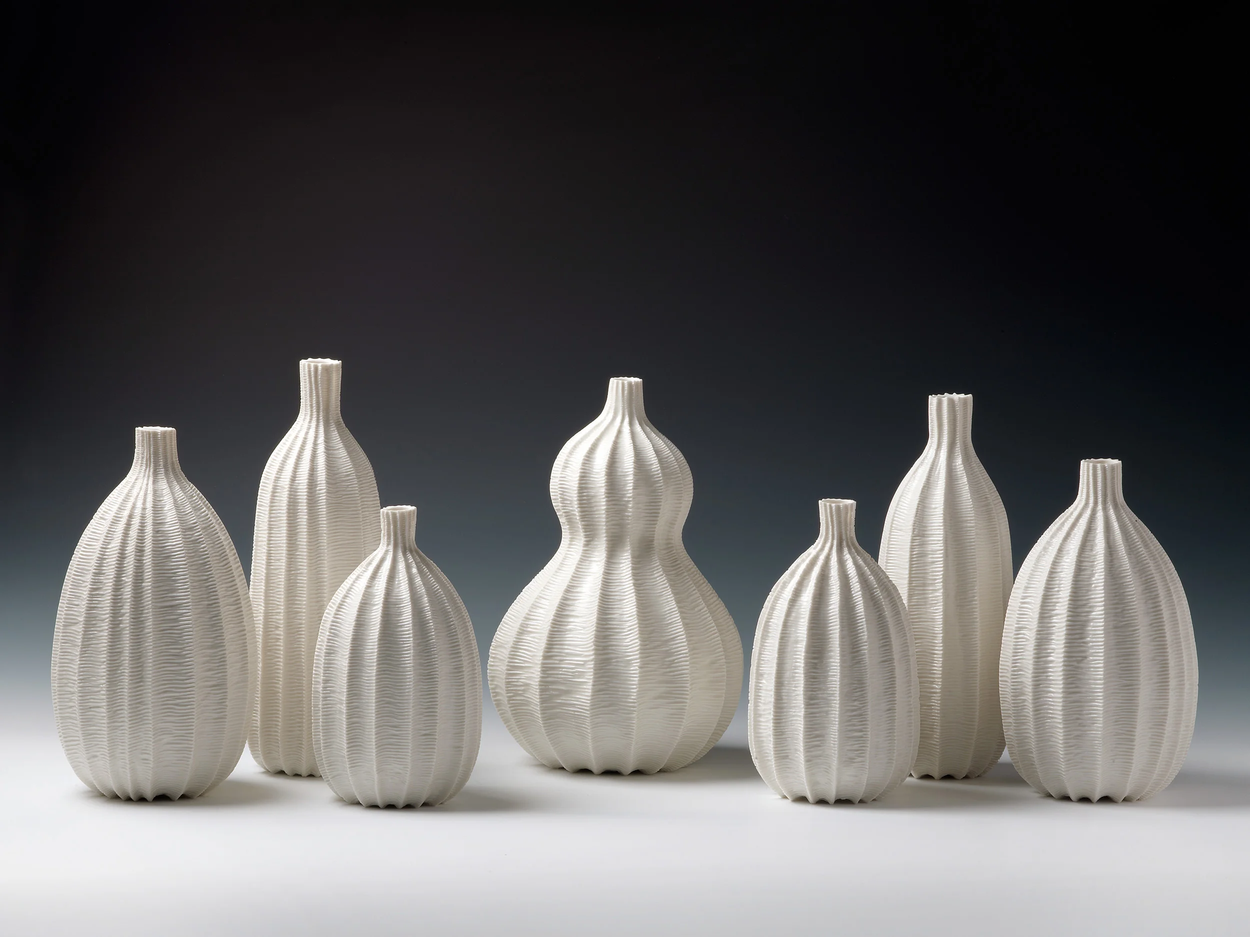 Garniture of Seven Vases, 2012. Thrown and carved porcelain, height 28cm