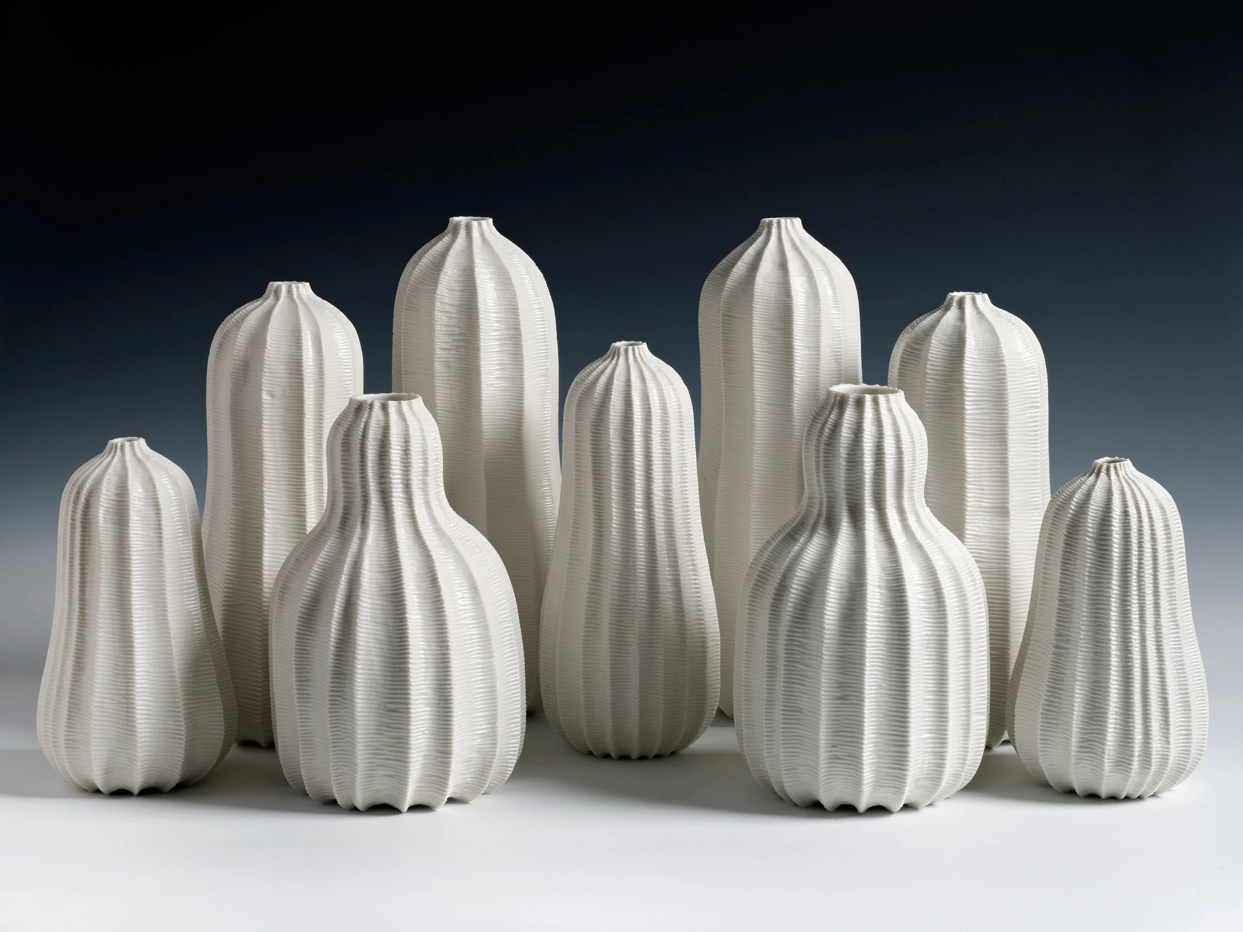 Garniture of Nine Vases, 2013. Thrown and carved porcelain. Height 35cm