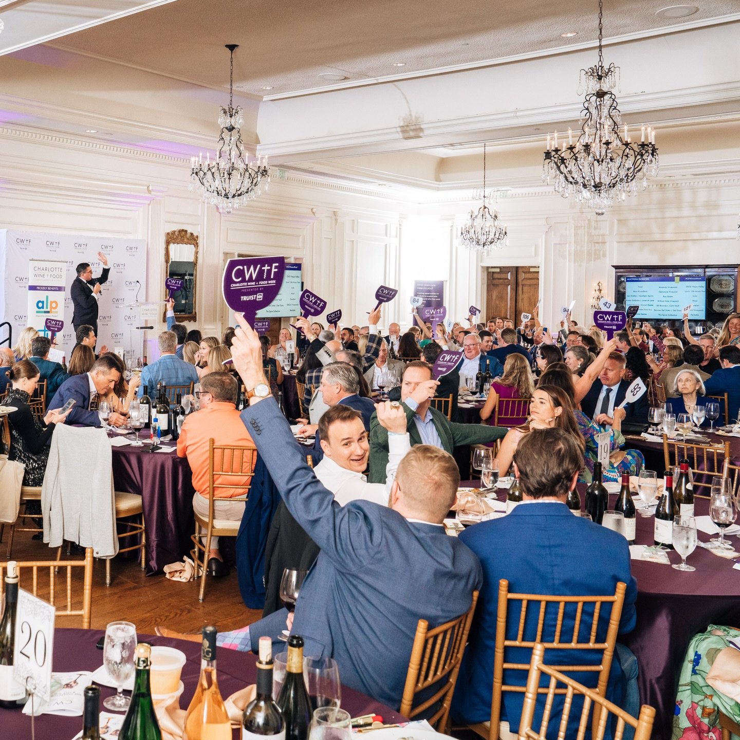 Live auctions are the cornerstone of Charlotte Wine + Food Week, where generosity meets excitement!

Every paddle raised during Charlotte Wine + Food Week helps provide stability and resources for local children and families through our four amazing 