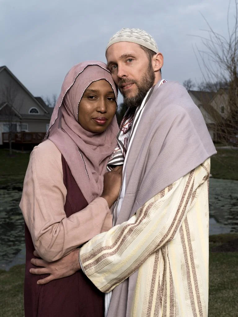 Kamilah Munirah Bolling and Adil Justin Cole stand outside their home in Farmington Hills, Michigan. by WAYNE LAWRENCE