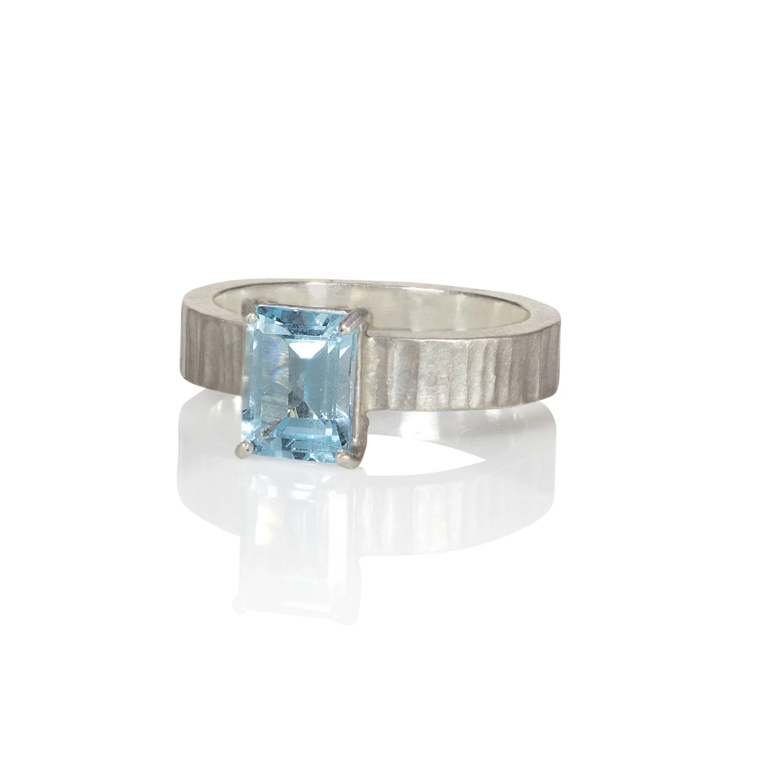 Cambium wide band blue topaz ring.jpeg