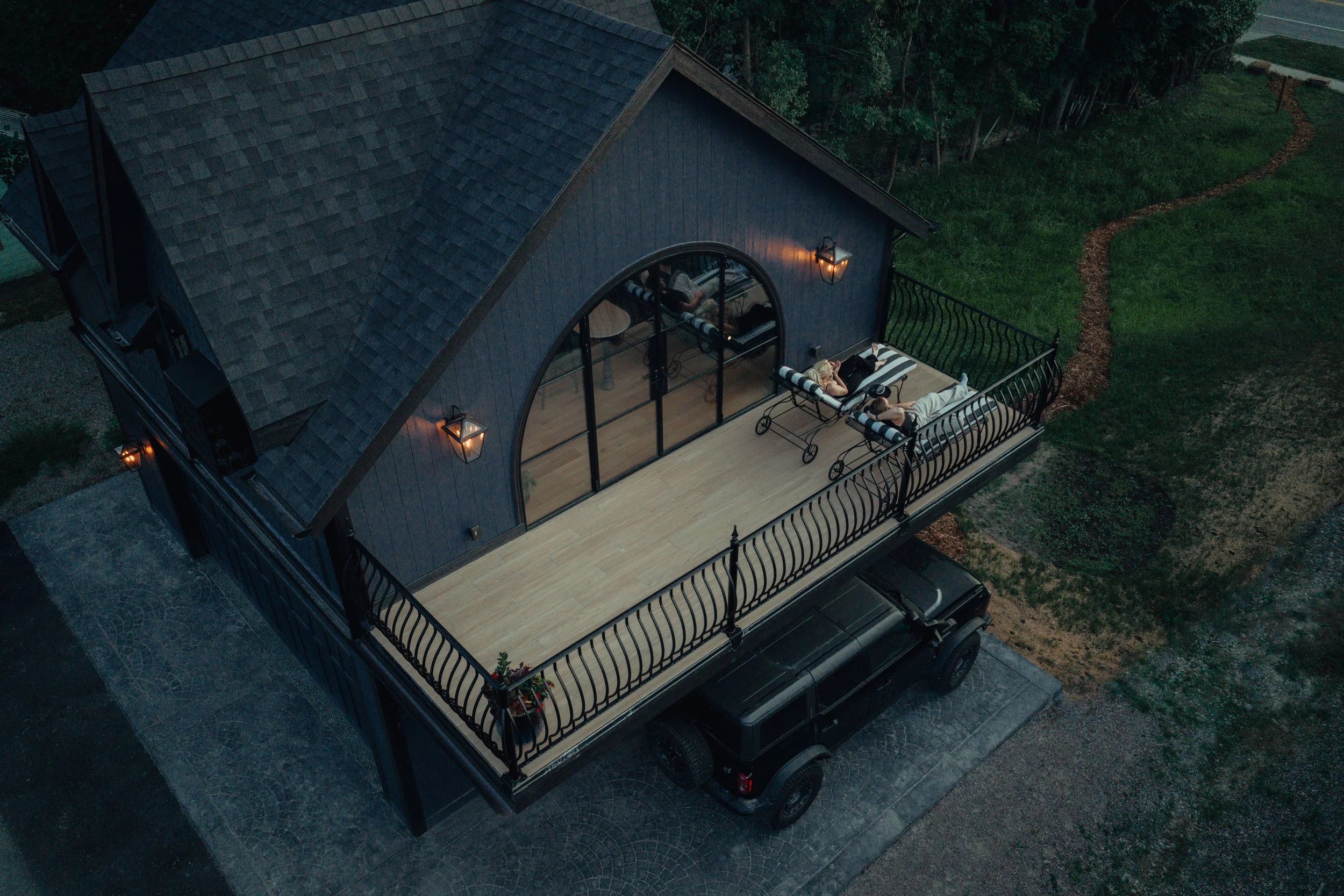  Aerial view of the Shadowplay Carriage House balcony and custom arched steel doors. 