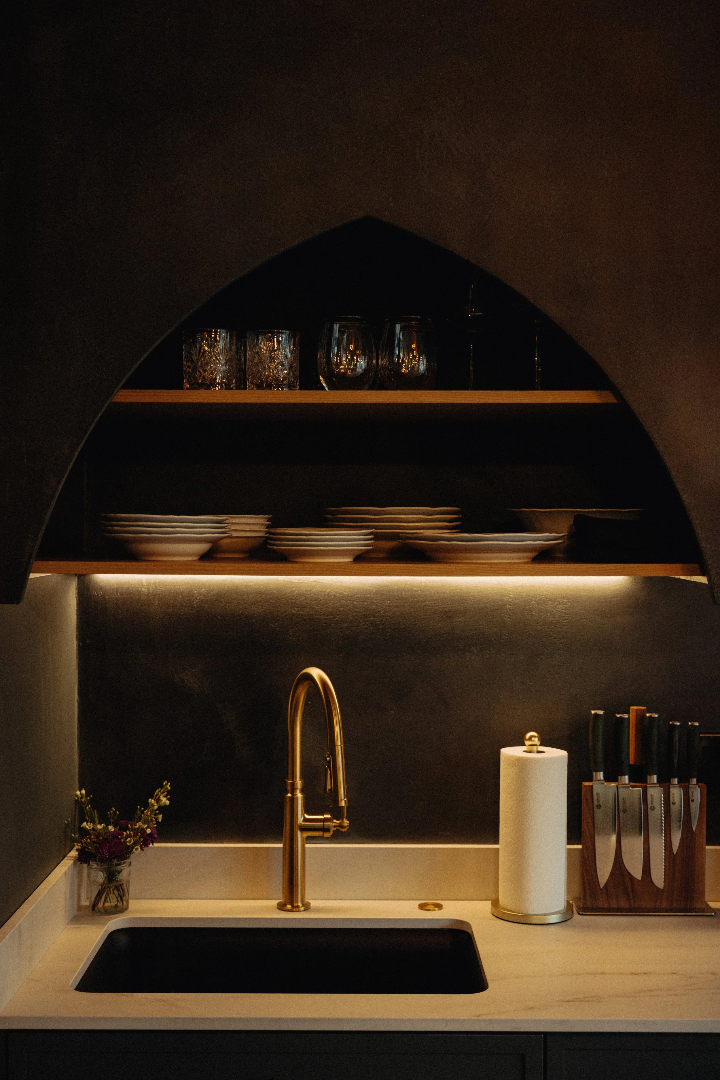  Kitchen sink with integrated arched storage and lighting. 