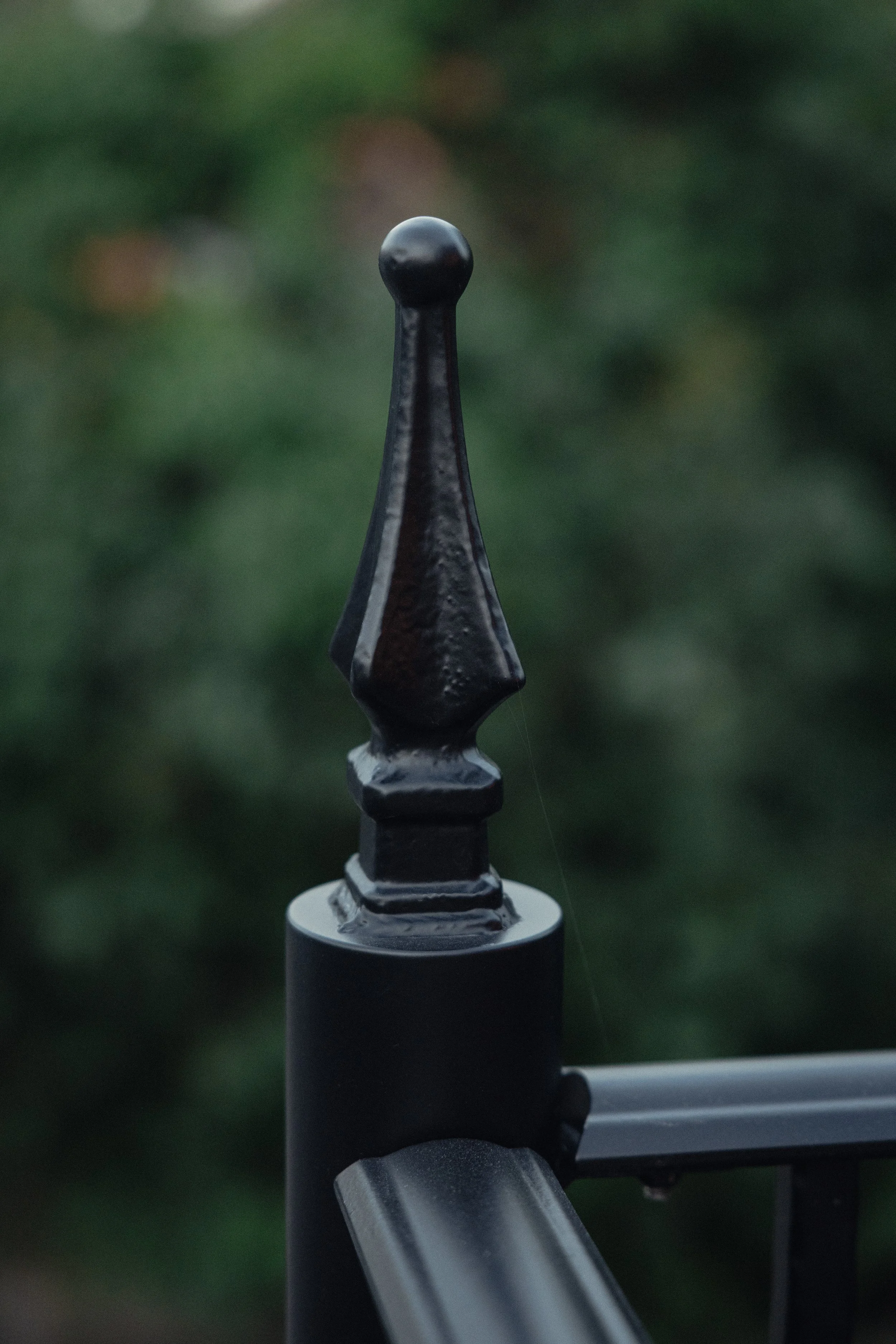  Custom steel finial detailing at the balcony railing posts. 