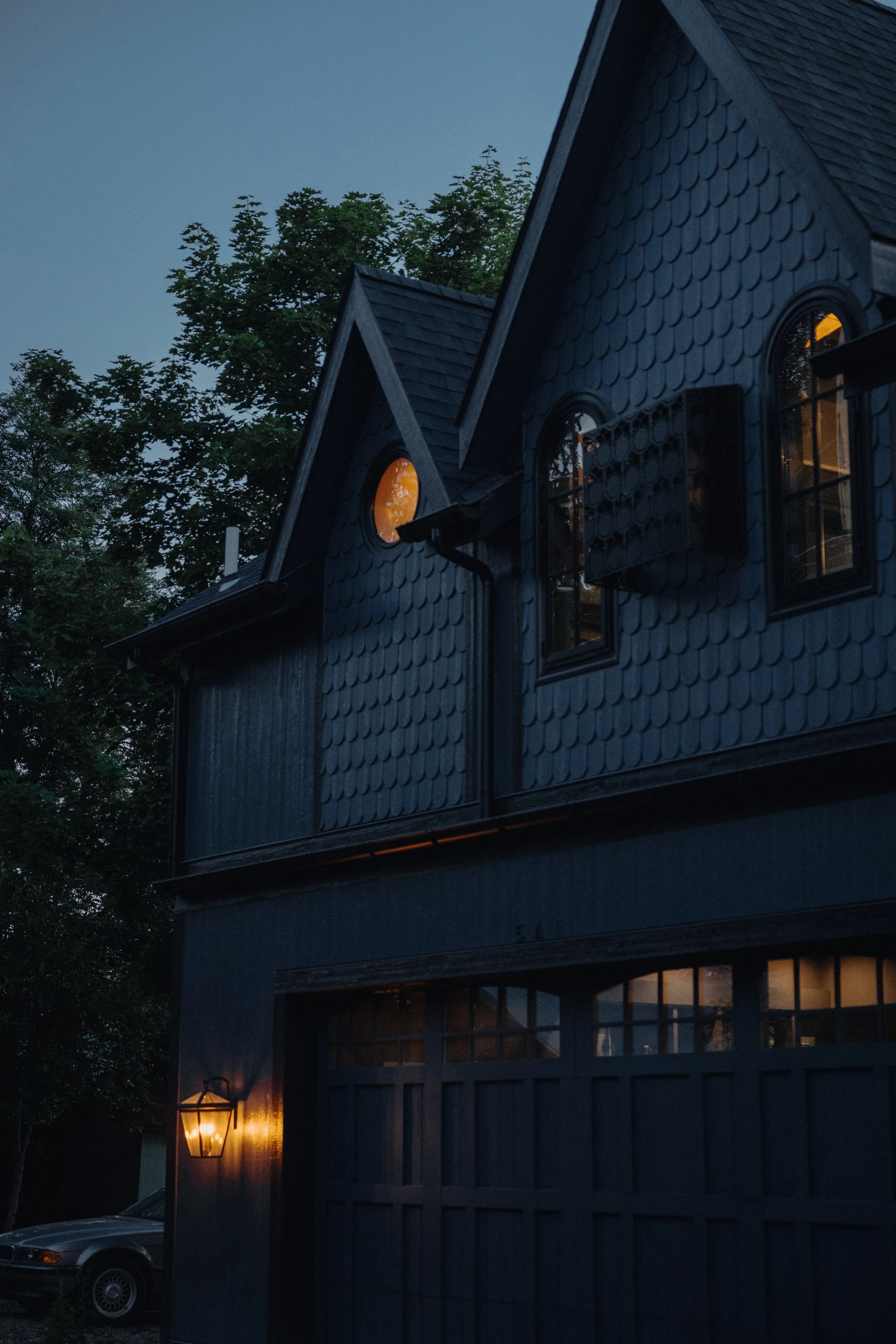  Exterior view featuring the custom steel bat box and gabled roof forms. 