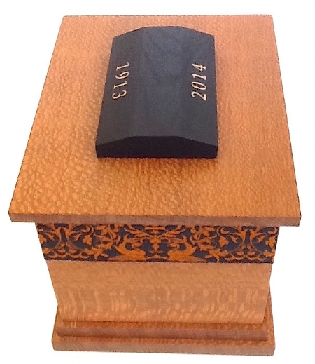 Quercus – 2015 – Funeral Urn with Gold Leaf inscribed birth & year of passing. 20cm W x 16cm L x 28cm H – with Ebonized Lacewood finial & Silk lining. Lacewood / Gold Leaf / Silk embroidered Ribbon Banding / Beeswax. PRIVATE COMMISSION