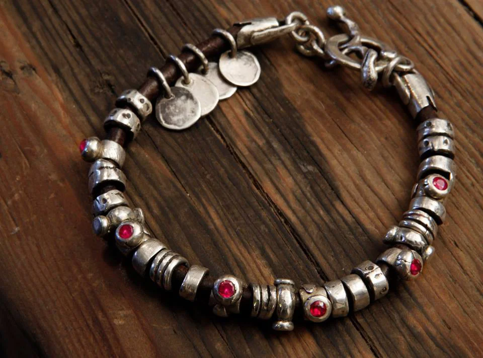 Sterling bead bracelet with rubies and charms