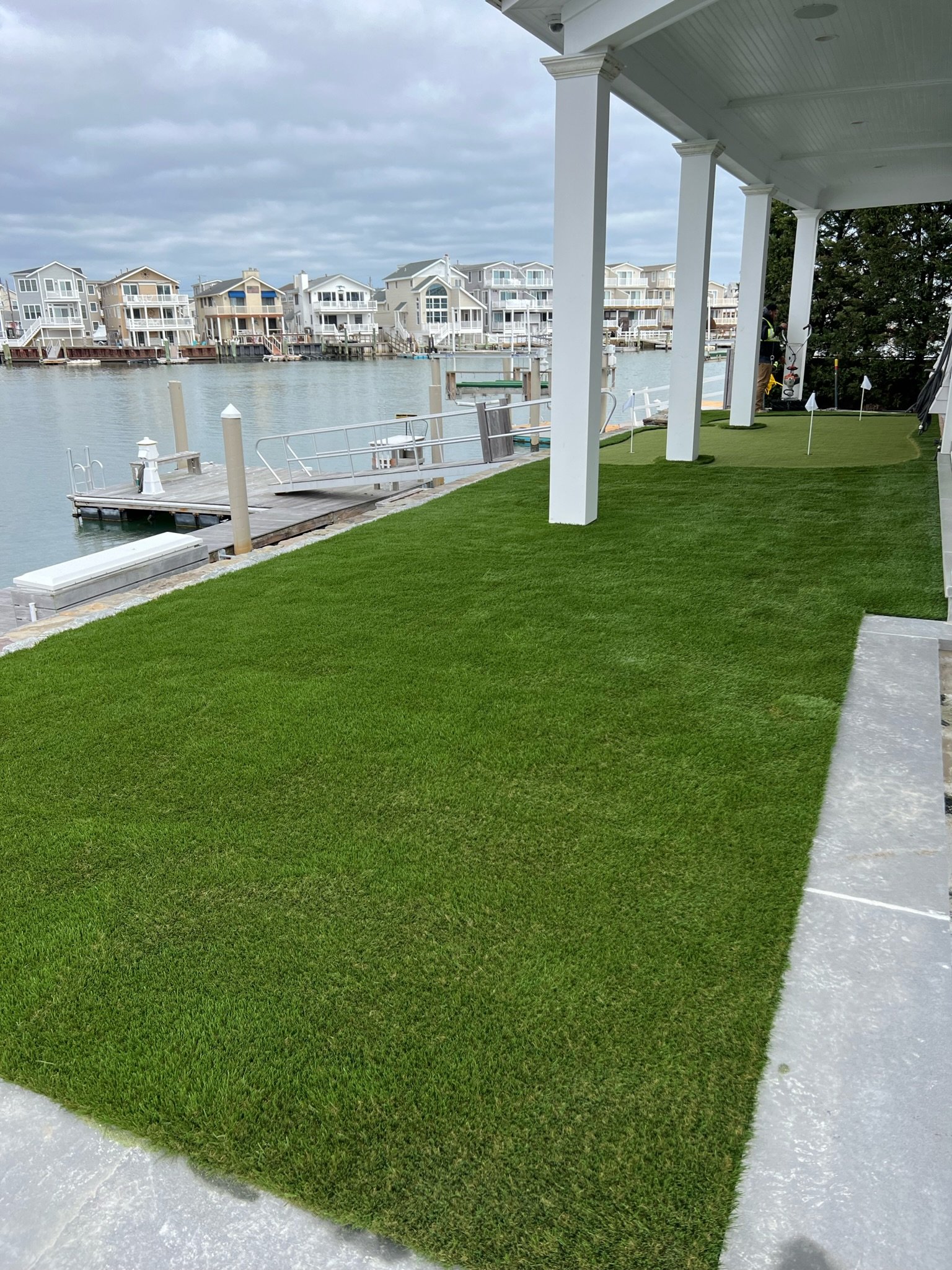 image of shore home with artificial grass