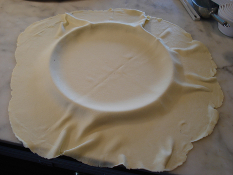 5) Dough draped onto the pizza pan