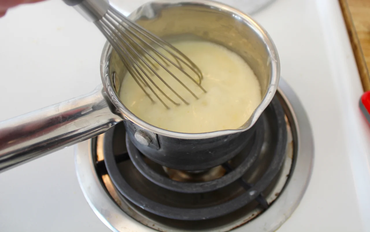 3) bringing cream and gelatin mixture to a boil