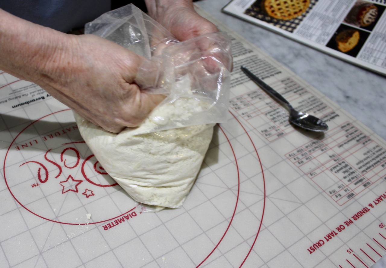 kneading dough until mostly holding together