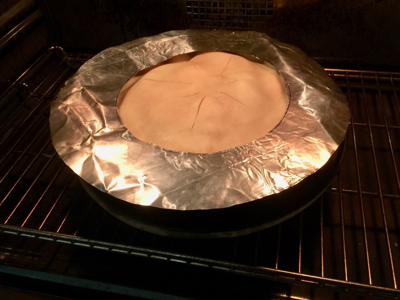 baking the pie with pie crust shield