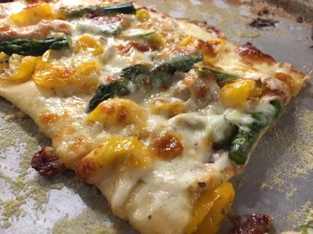 Cheesy asparagus tomato pizza 