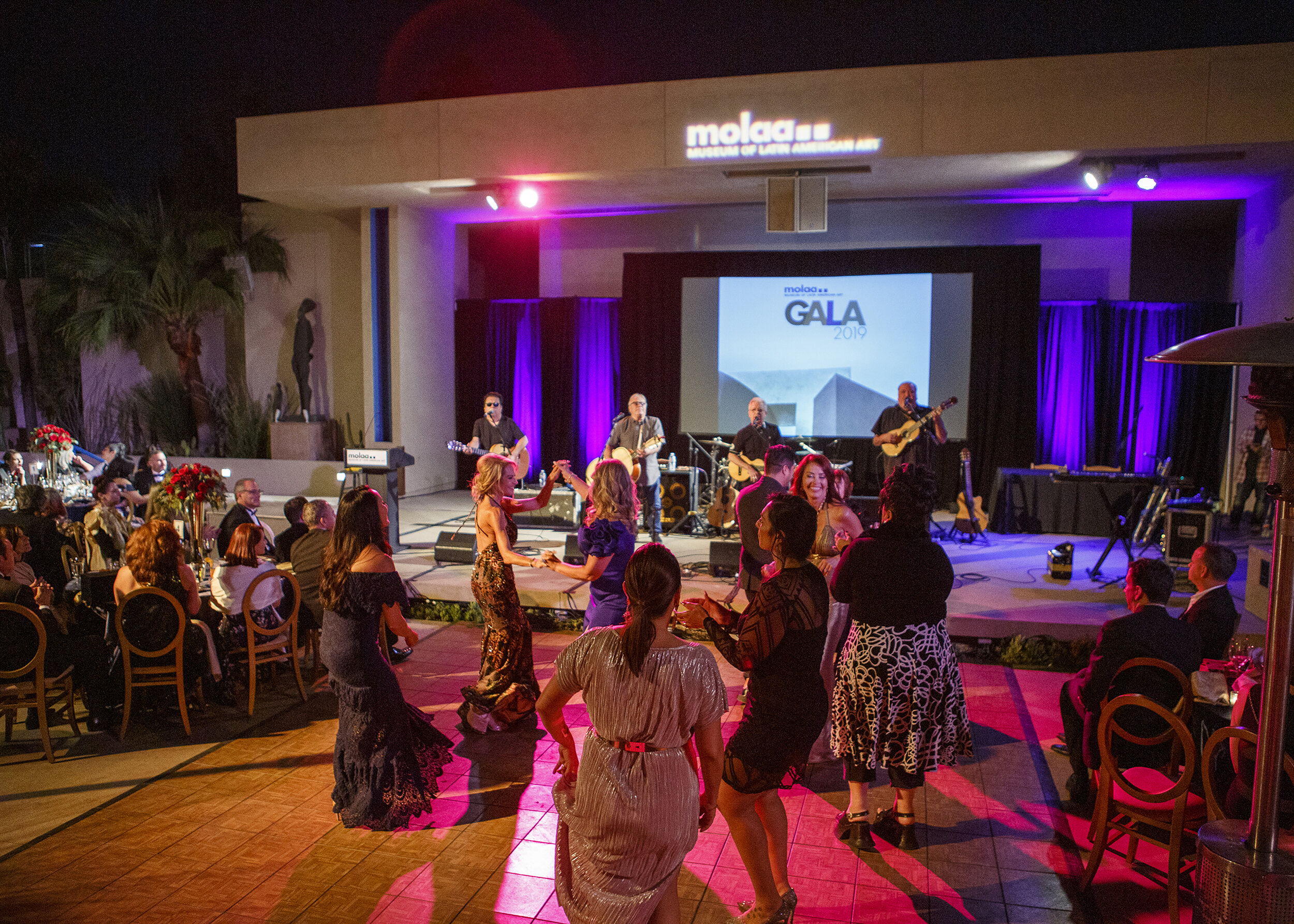  GRAMMY award-winning Los Lobos playing in the Robert Gumbiner Sculpture &amp; Events Garden at MOLAA’s Annual Gala, 2019. Photo by Justin Galligher. 
