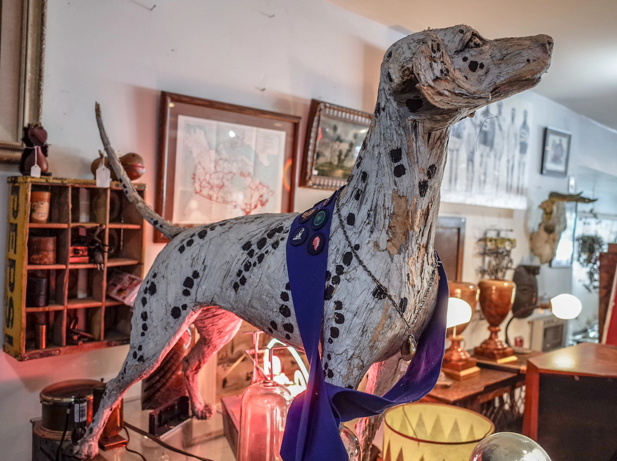 A large vintage dalmatian dog statue and unique home ornaments on display at Space Lab Vancouver, linking to the antique decor collection page.