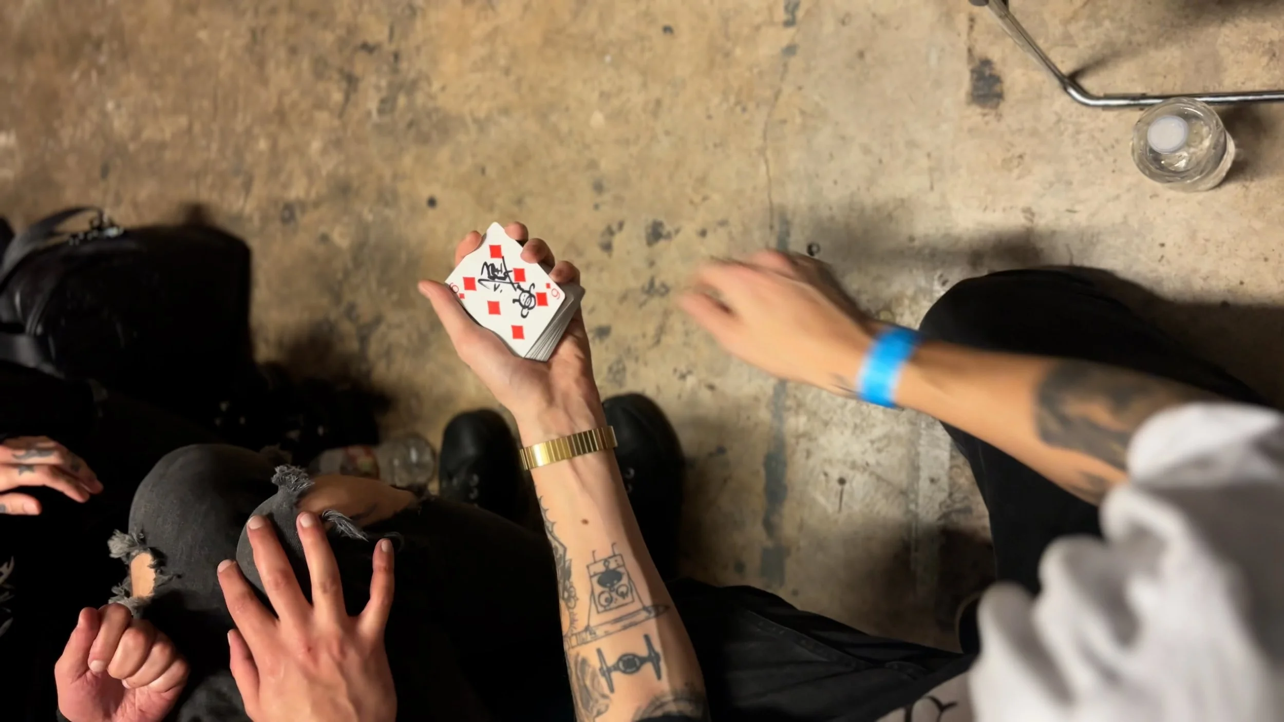 Custom signed playing cards from a Houston wedding magic performance, creating a unique souvenir deck for the bride and groom.