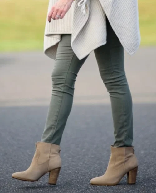 This look isn't the best, because the jeans are tucked in like tights, and the booties are a different color than the pant, which creates a chopped up unsophisticated look.