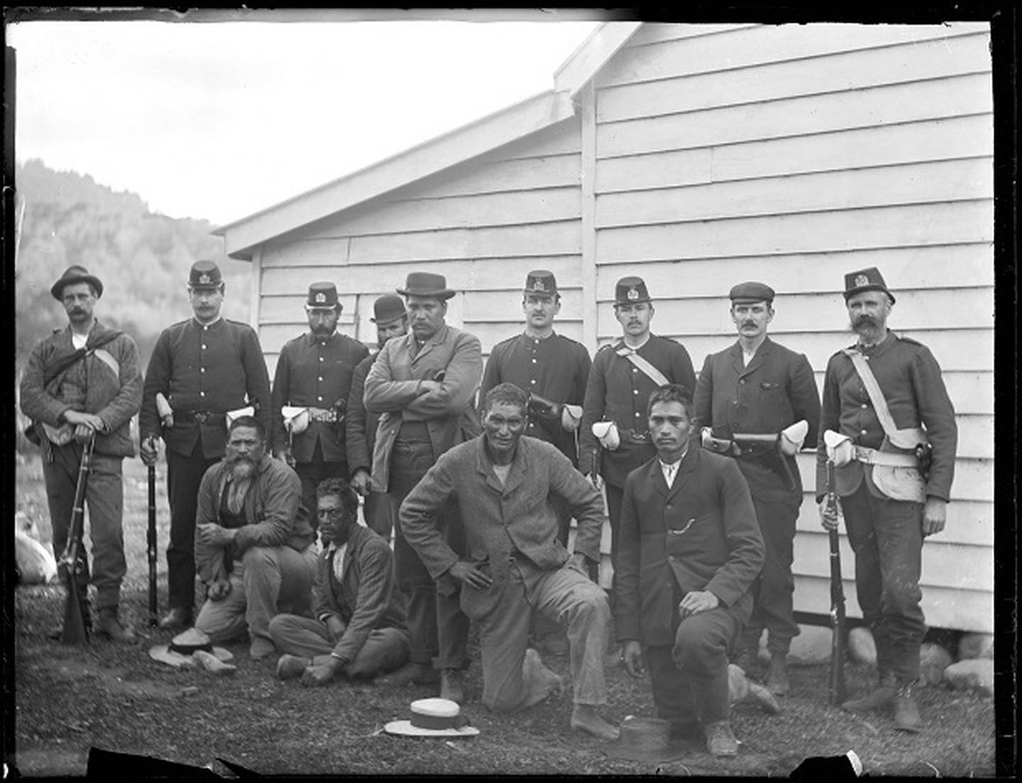 C.P. Dawes: Māori dog-tax resisters, including leader Hone Toia (centre, standing), following their surrender at Waima in Northland in 1898. Auckland Libraries Heritage Collection