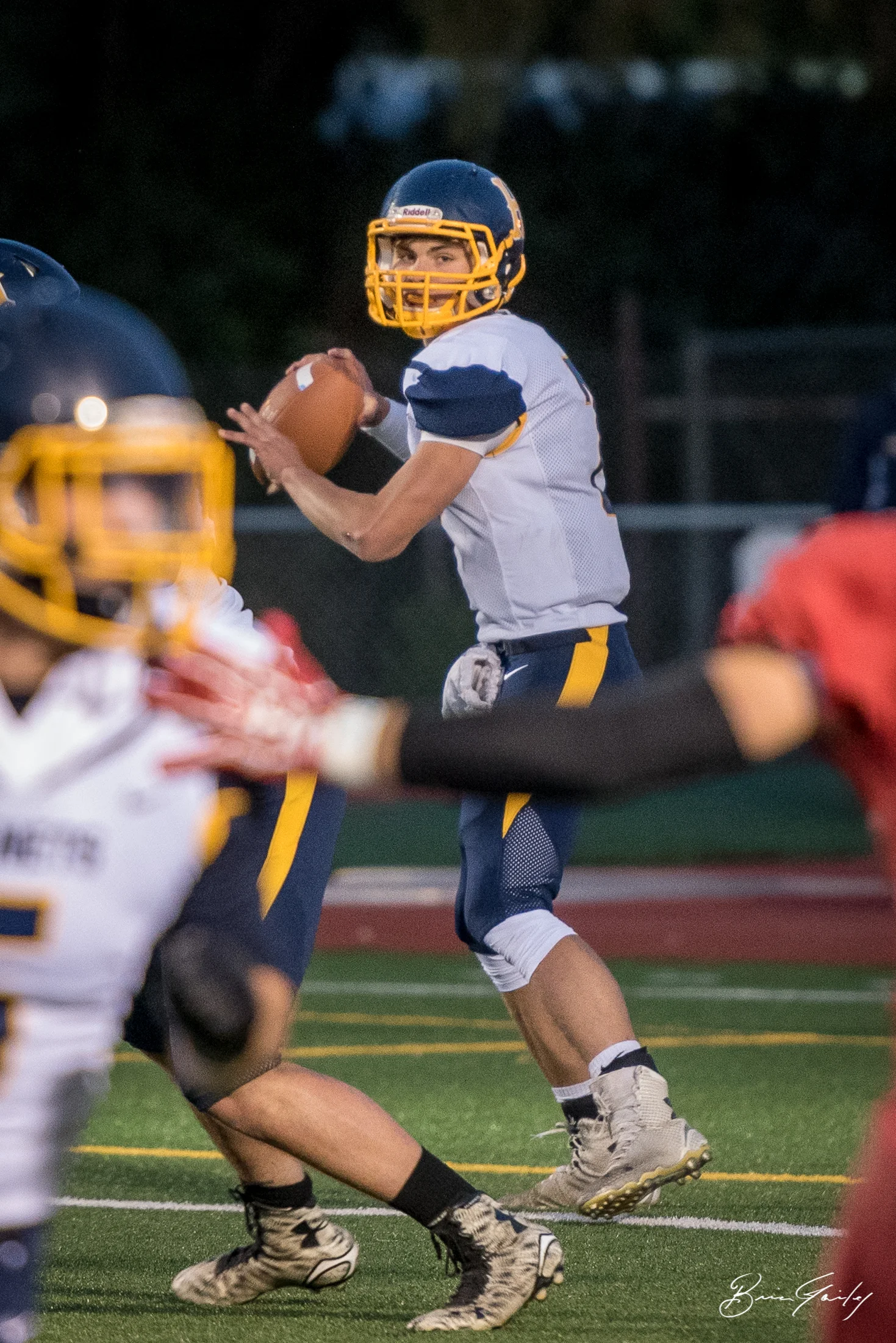 Hornet Quarterback #7, Kyle Hadwick studies the field looking for his target. 