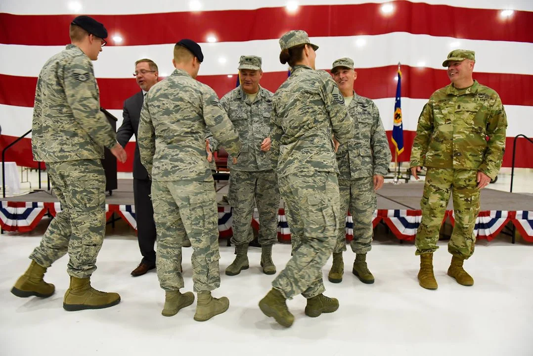 Members of the official party shake hands with Airmen from the 173rd Fighter Wing during a demobilization ceremony Nov. 4, 2017, at Kingsley Field in Klamath Falls, Ore. The ceremony formally recognized the wildland fire fighters and the 56 Kingsley Field Airmen who deployed during the wing’s first ever large-scale deployment throughout 2017. (U.S. Air National Guard photo by Staff Sgt. Riley Johnson)