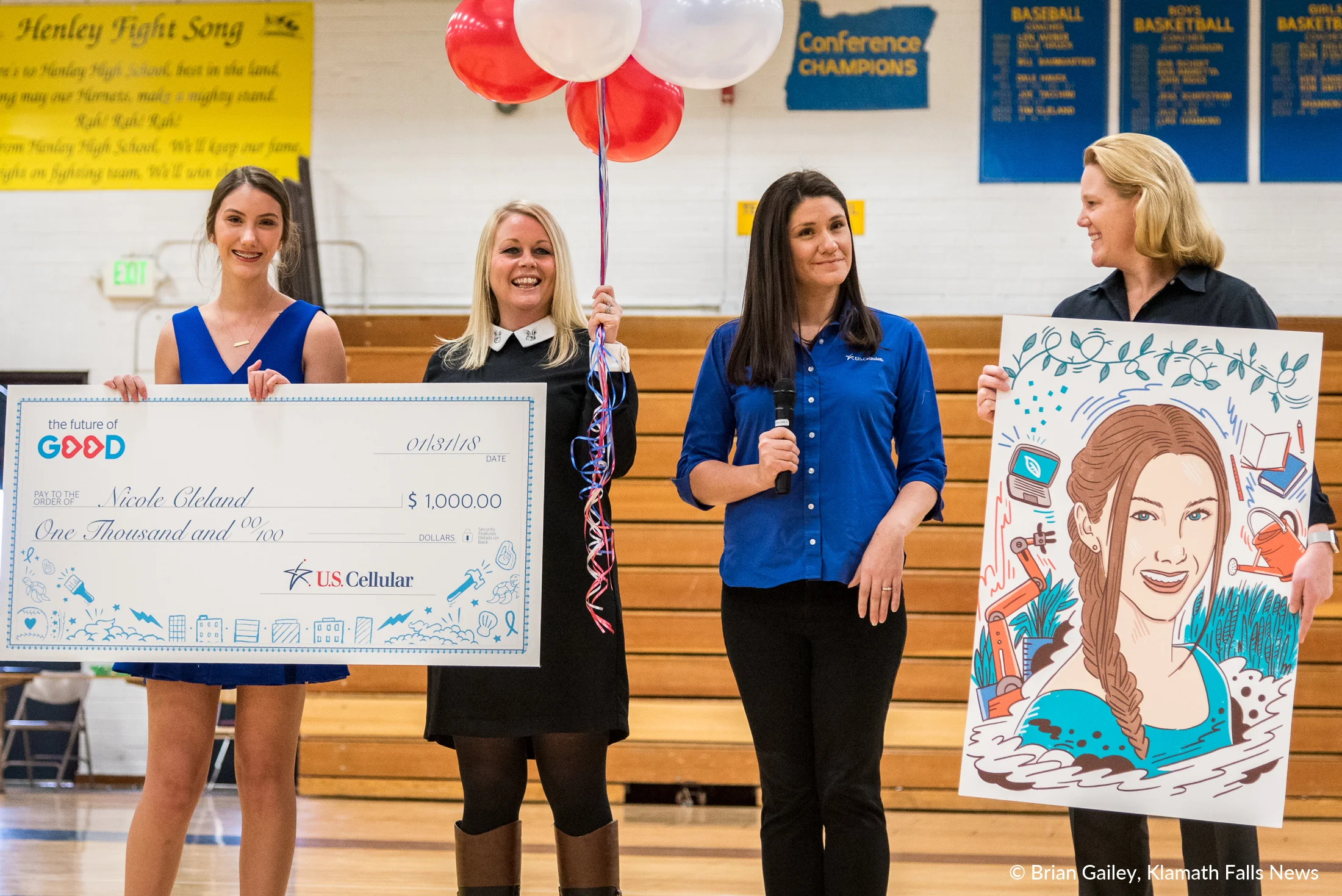 Nicole Cleland receives an award from US Cellular and the Future of Good for her commitment to Beyond the Bell. 