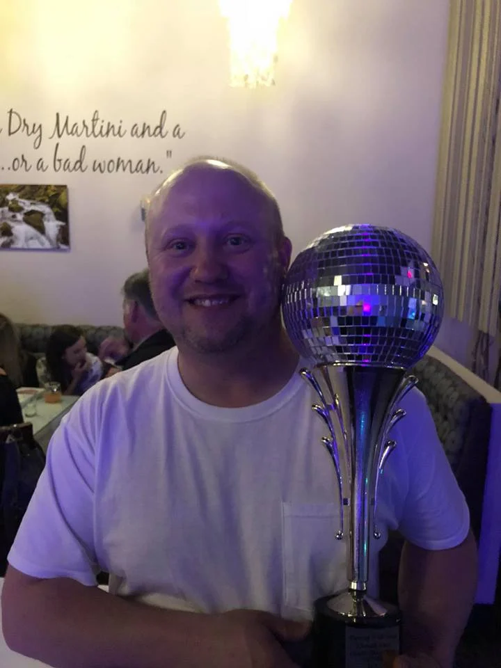 Tony "AJ" Halda, holds the Mirror Ball Trophy as the 2018 Winner of Dancing With Your Stars (Ross Ragland Theater, Facebook).