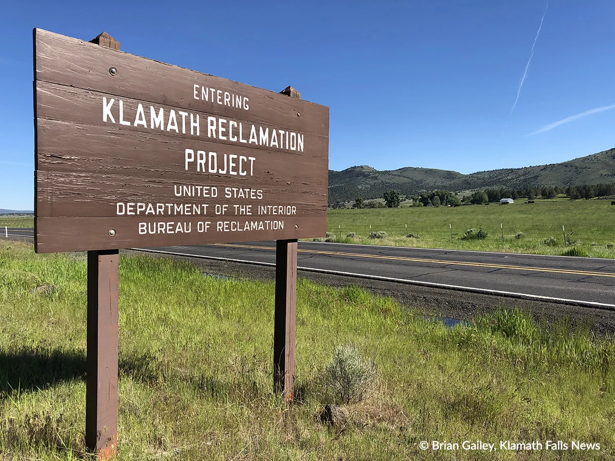 File Photo. Painted wooden sign marking the Klamath Project near Poe Valley, Ore. (Brian Gailey)
