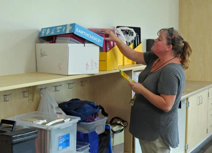 Stephanie Hull, a fifth-grader teacher at Peterson Elementary School, moves into a classroom last month in the new fifth-sixth grade building.