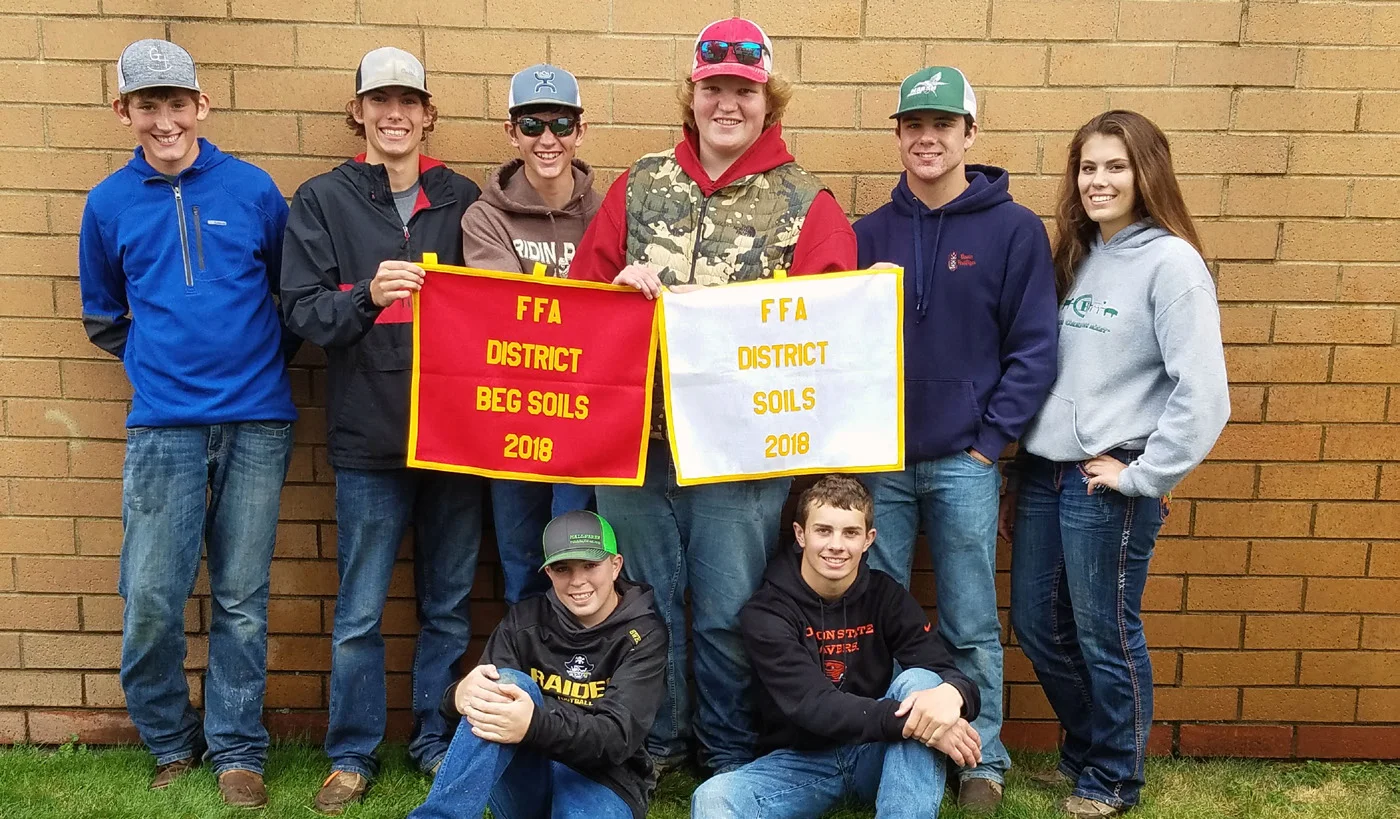 Bonanza FFA members show off their banners following the awards ceremony at the Southern Oregon District Soils Evaluation CDE Oct. 3. The chapter placed first as a team in the beginning and advanced contests.