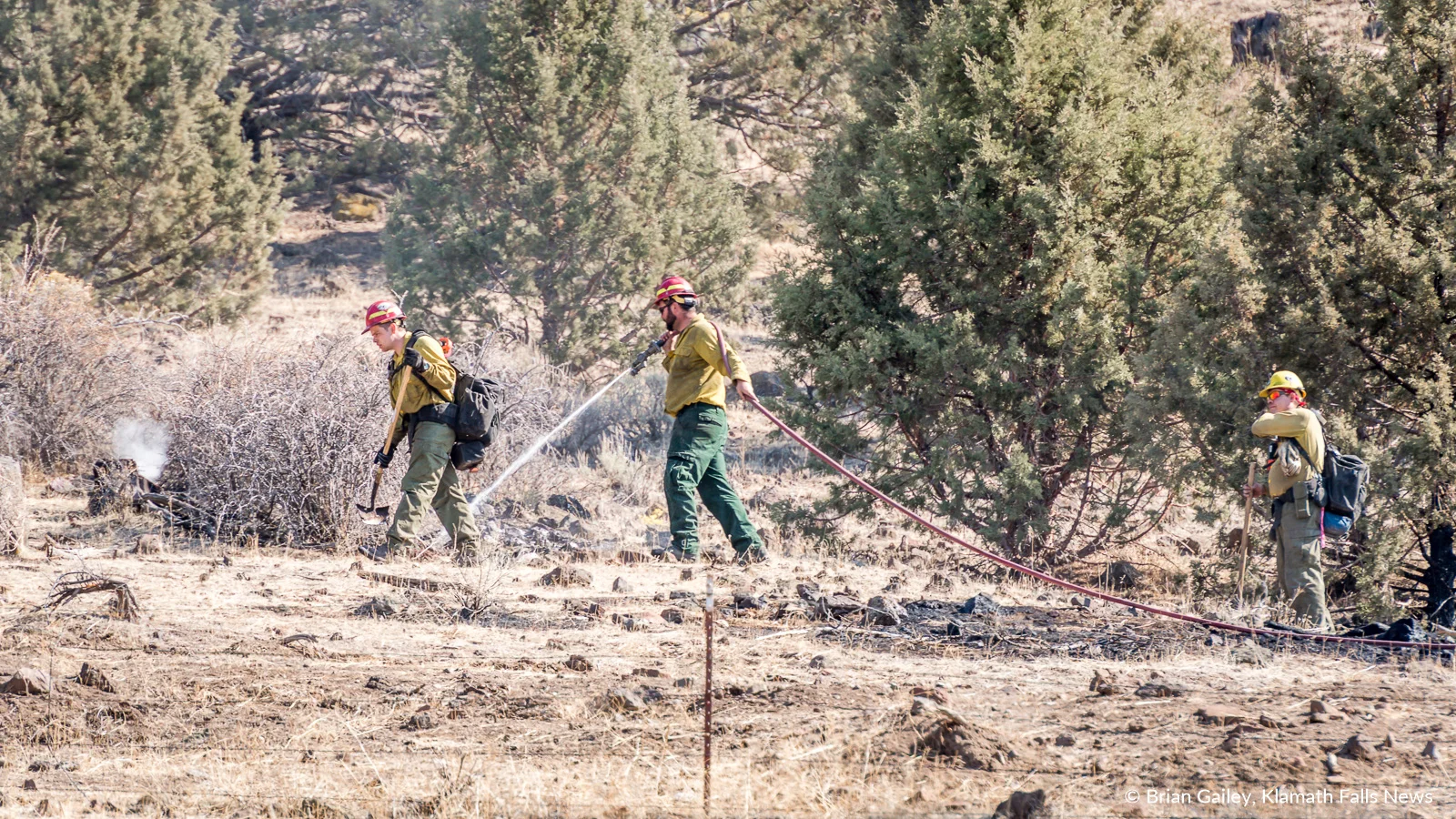 Firefighters work to extinguish spot fires on the Stukel Fire in Klamath County, Oregon. October 15, 2018 (Brian Gailey)