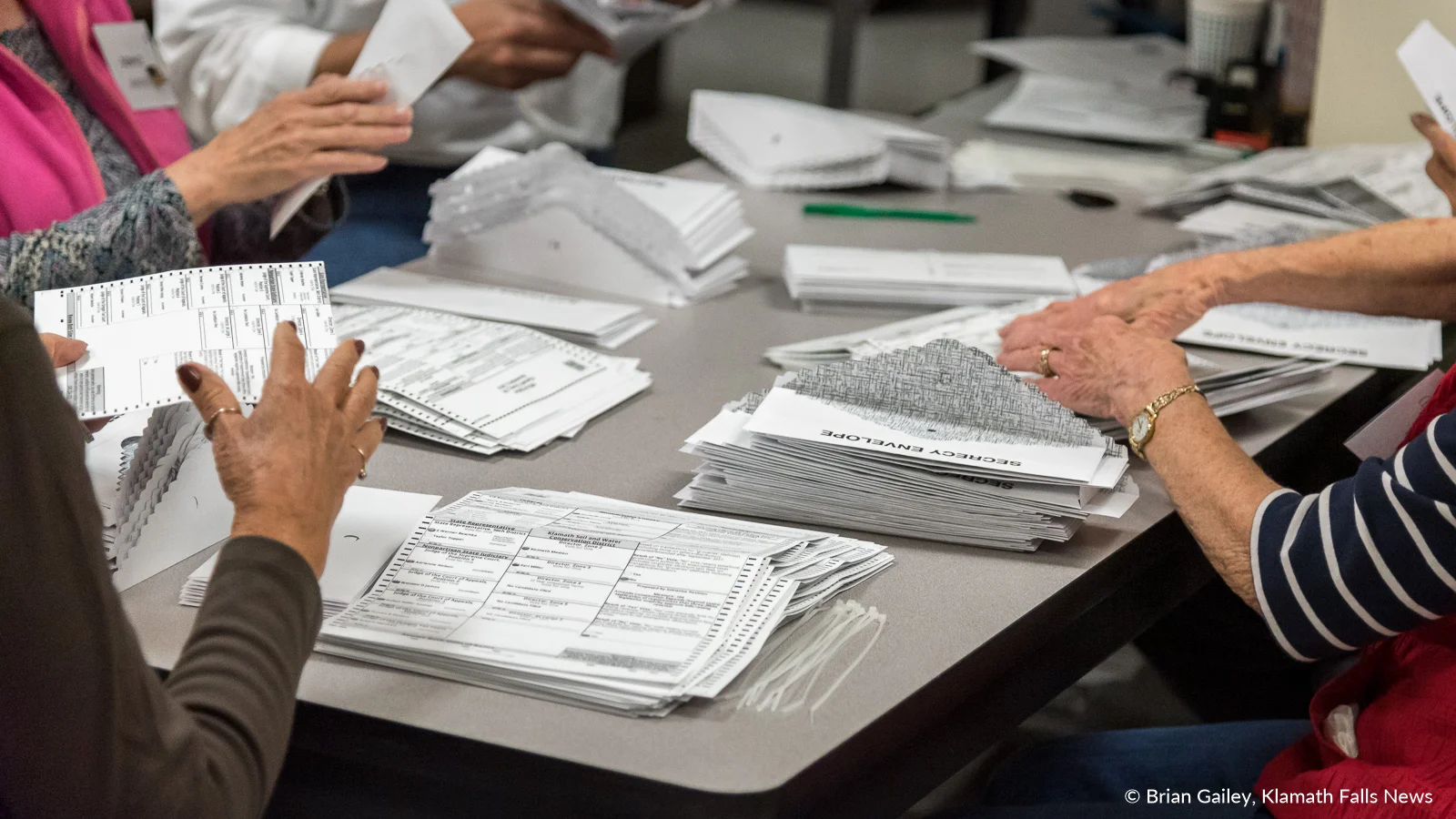 Volunteers at the Klamath County Clerks Office prepare ballots to be counted. November 6, 2018 (Brian Gailey)