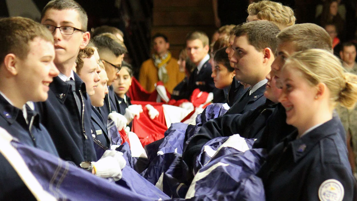 JrROTC Cadets prepare the flag for the National Anthem.
