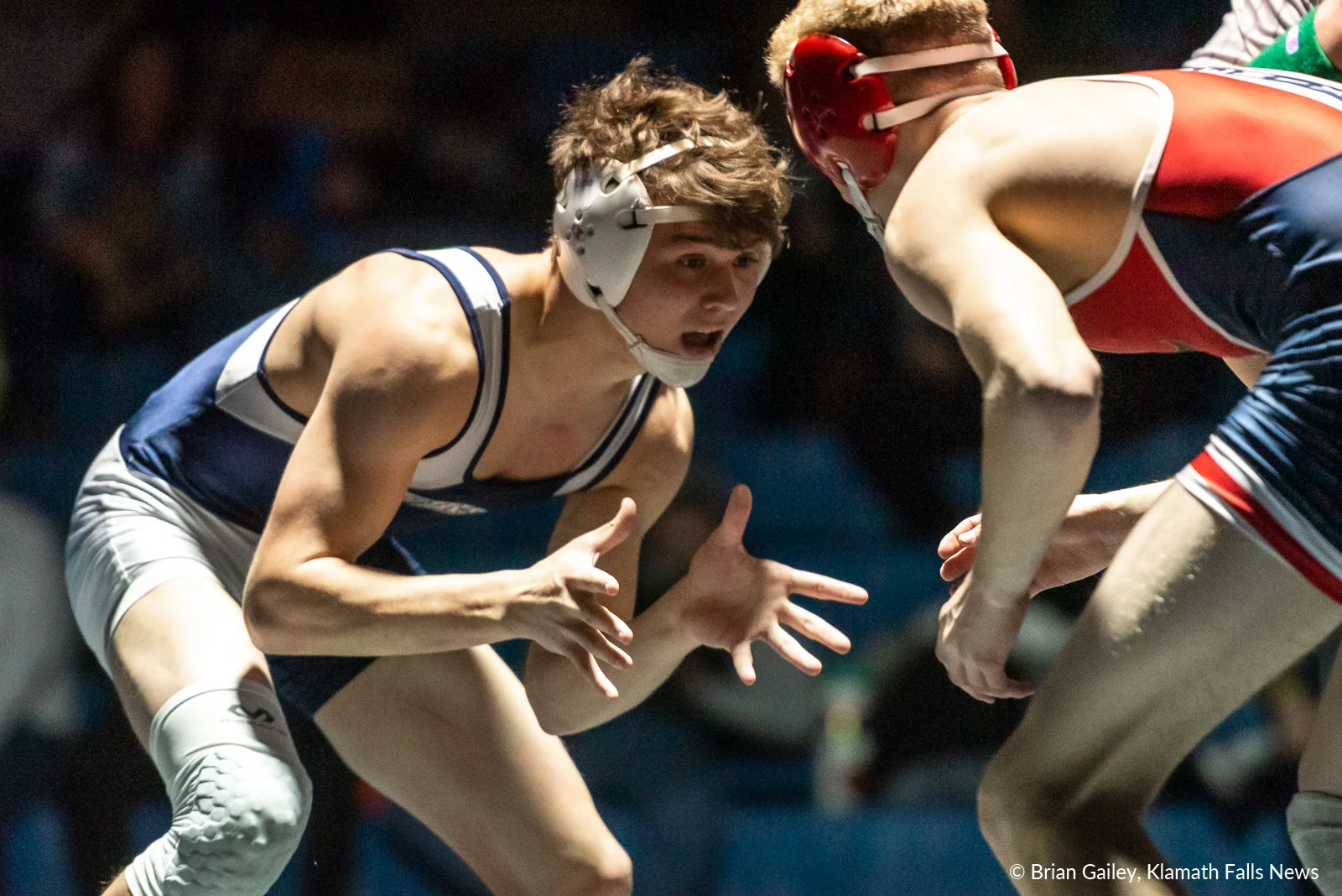 Kaden Wood (Mazama) prepares to lock up with Jacky Hawkins (Phoenix). Hawkins wins the 138 weight class, pinning Wood in 3:56. February 9, 2019 (Image by, Brian Gailey / Klamath Falls News)