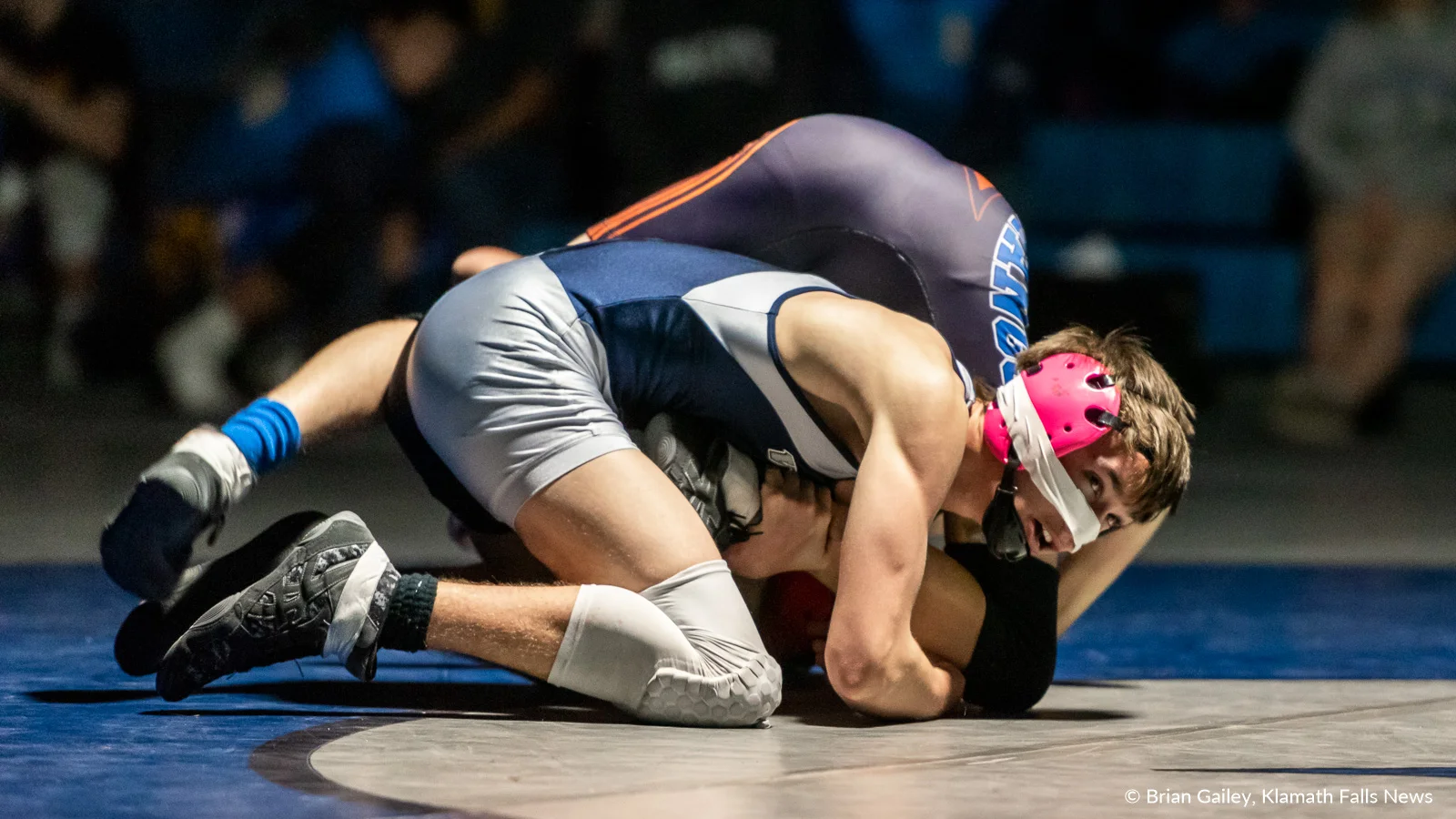 Kyler Pemberton (Mazama) suffers an injury to his nose during his championship match against Gabe Chavez (Hidden Valley) in the 106 weight class. Pemberton overcomes his injury winning over Chavez, 11-3. February 9, 2019 (Image by, Brian Gailey / Klamath Falls News)