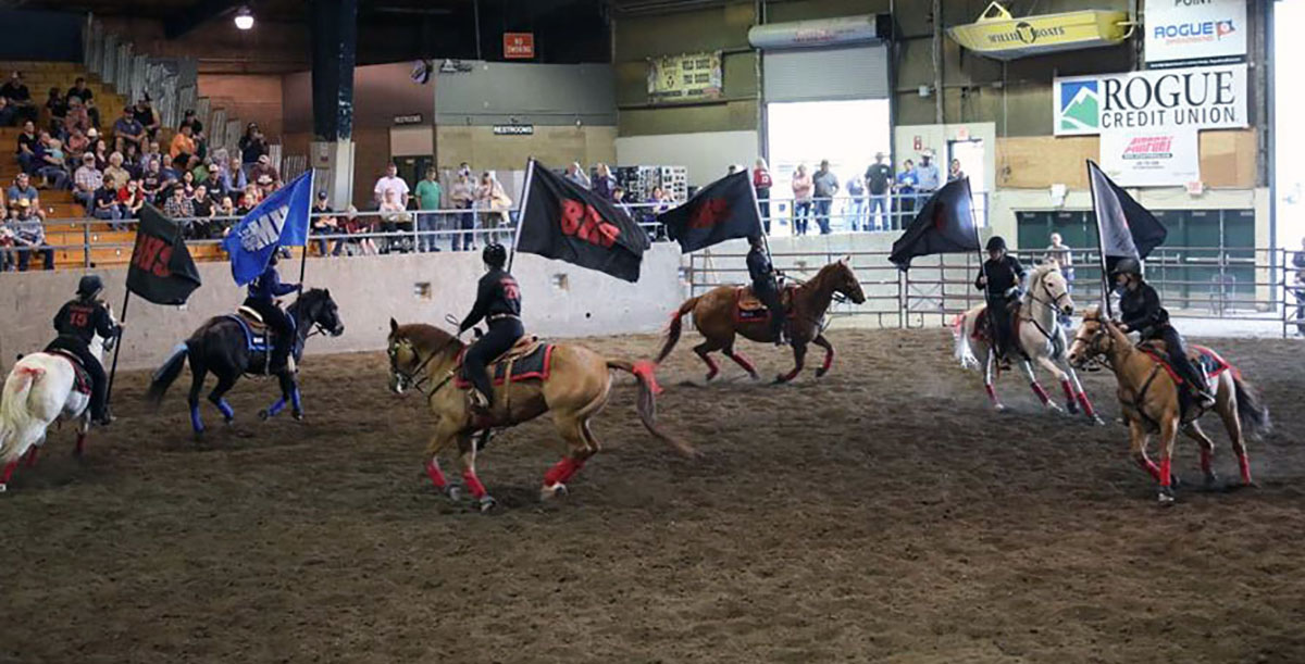 Members of the Bonanza/Mazama Freestyle 5+ Drill Team -- Madelyn Bloom, Kaitlyn Bloom, Abby Orella, Grace Orella and Shelby Gibbs of Bonanza; and Janah Moorer of Mazama -- perform a maneuver in the district finals competition April 26 at the Jackson County Expo. Photo credit: Linda Bryant