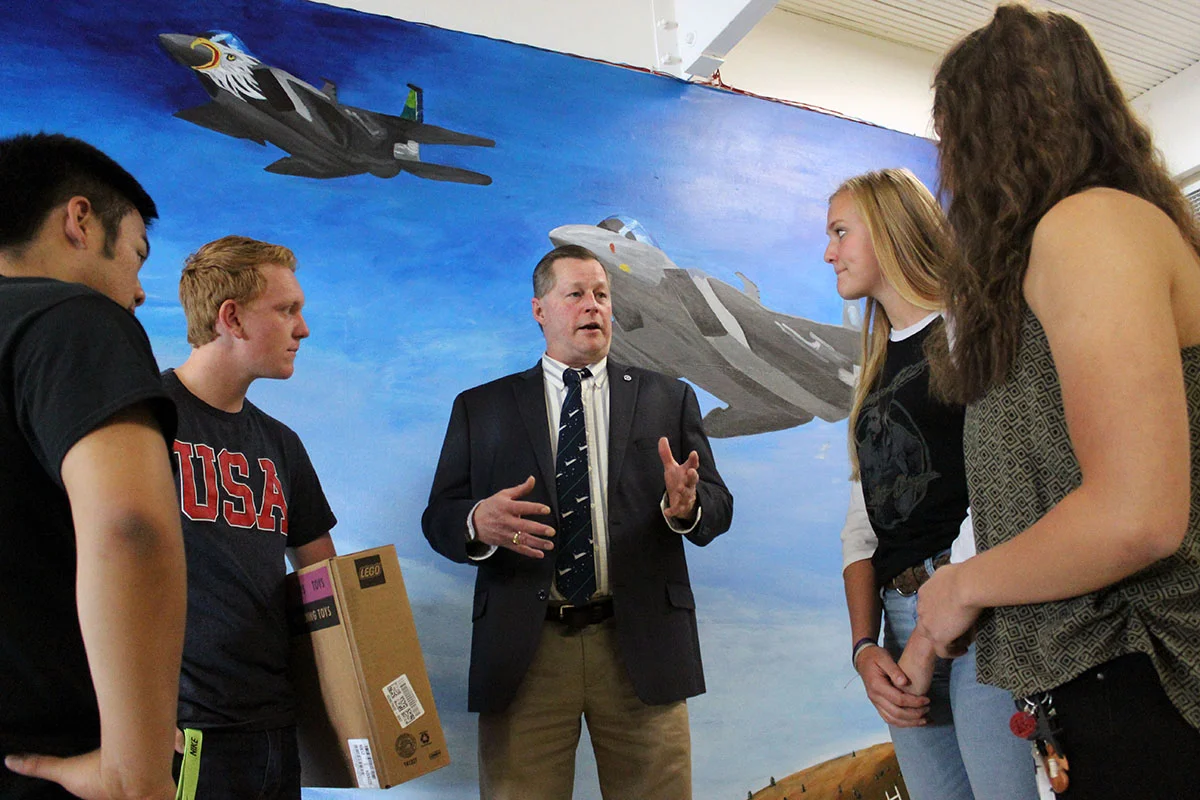 Henley High School engineering students Dylan Huhyn, Thys deHoop, Grace Parker and Alyssa Michaelis talk to James Loftus, director of JPLMuseum.
