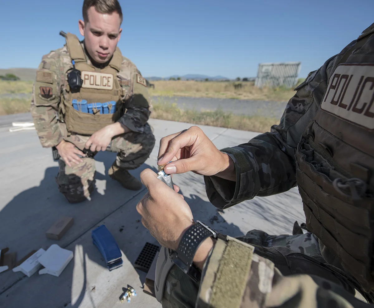 A Security Forces Airmen from Beale Air Force Base, California loads Simunitions rounds into a magazine during a tactical team competition at Kingsley Field in Klamath Falls, Oregon as part of a grand opening for the newly constructed “shoot house”, July 24, 2019. The facility is the only one of its kind within a four hour driving radius, prompting the active-duty unit to bring two teams in order to gain valuable training otherwise unavailable to them. (U.S. Air National Guard photo by Master Sgt. Jefferson Thompson)