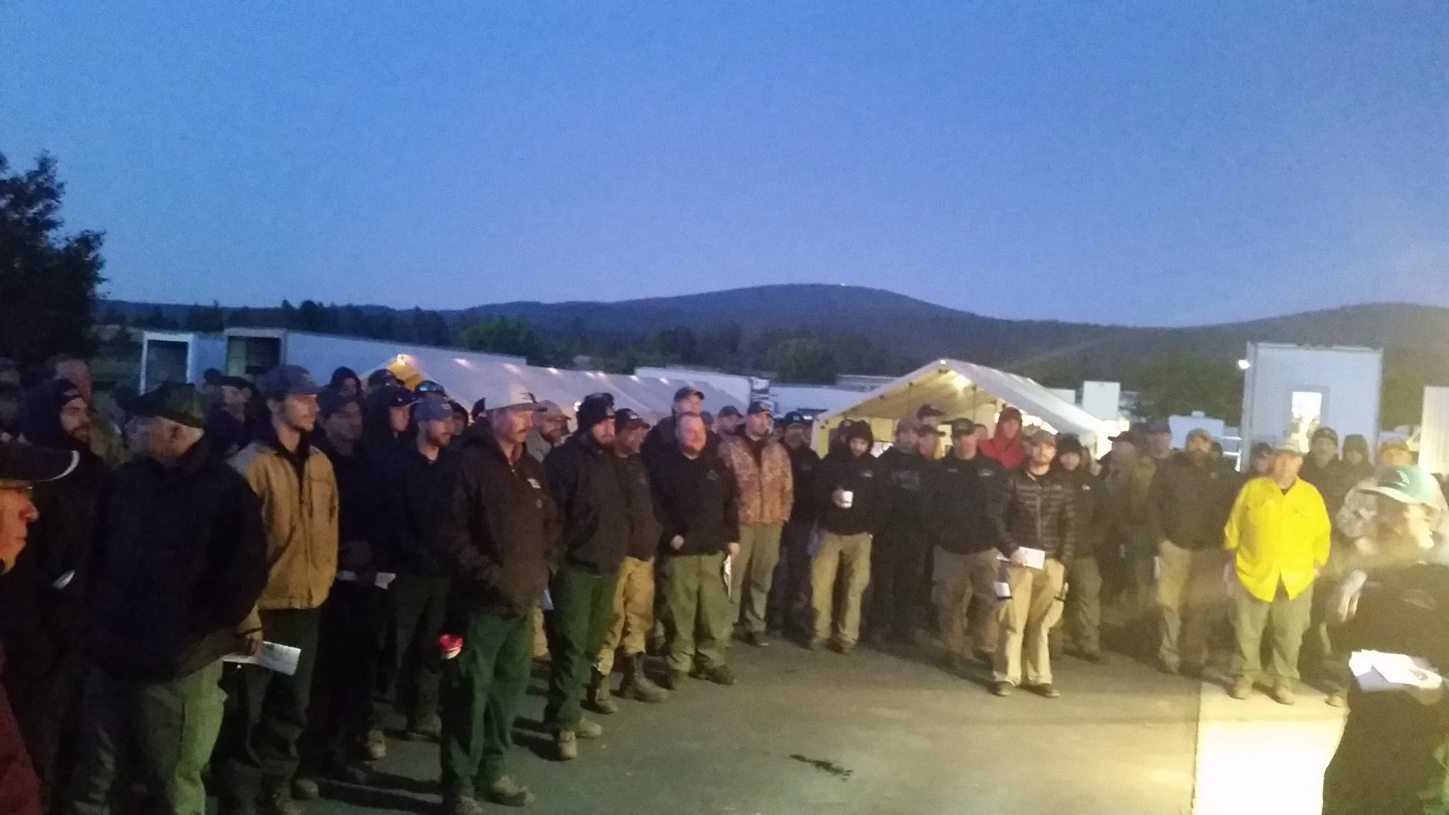 Firefighters gather for the morning briefing. (Ward Fire Facebook)