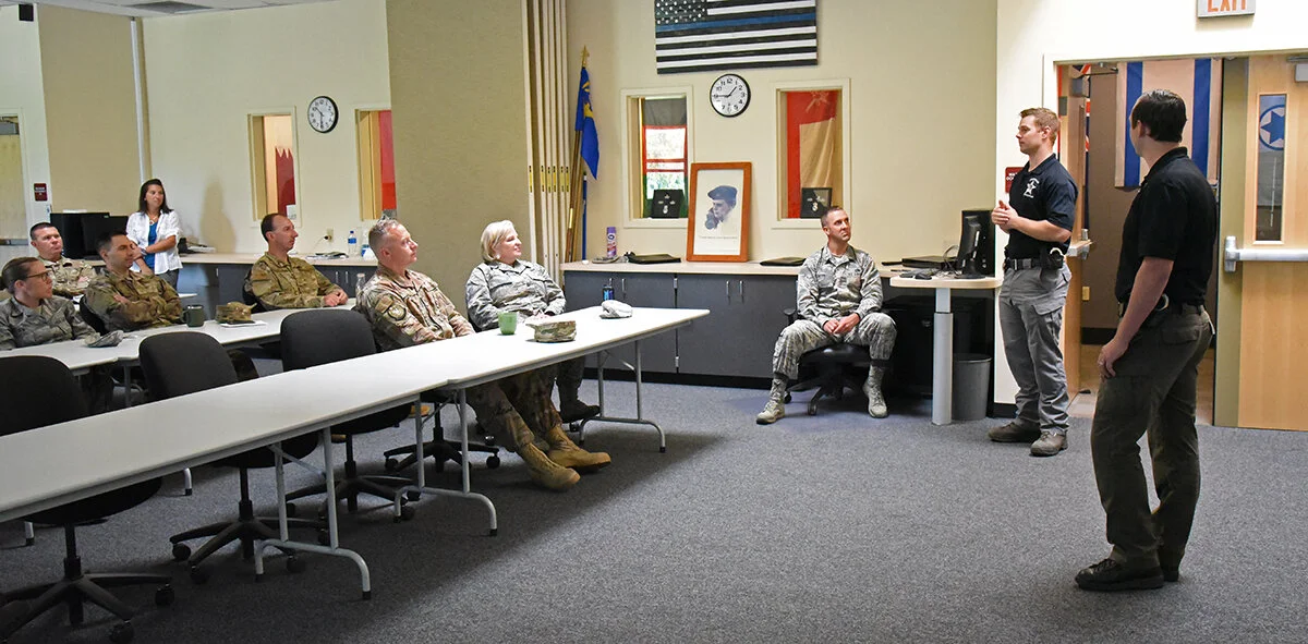 Oregon State Police Detectives Thomas Andreazzi (right) and Kyson Culp took an hour to explain how they are seeing a very rapid expansion of child predators targeting children as young as five through the proliferation of social media applications during a Community Connections event organized by the Sexual Assault Prevention and Response office at the 173rd Fighter Wing, Sept. 5, 2019. The event was geared to help Airmen at Kingsley Field in Klamath Falls, Oregon, protect their children from a growing cybercrime threat. (U.S. Air National Guard photo by Master Sgt. Jefferson Thompson)