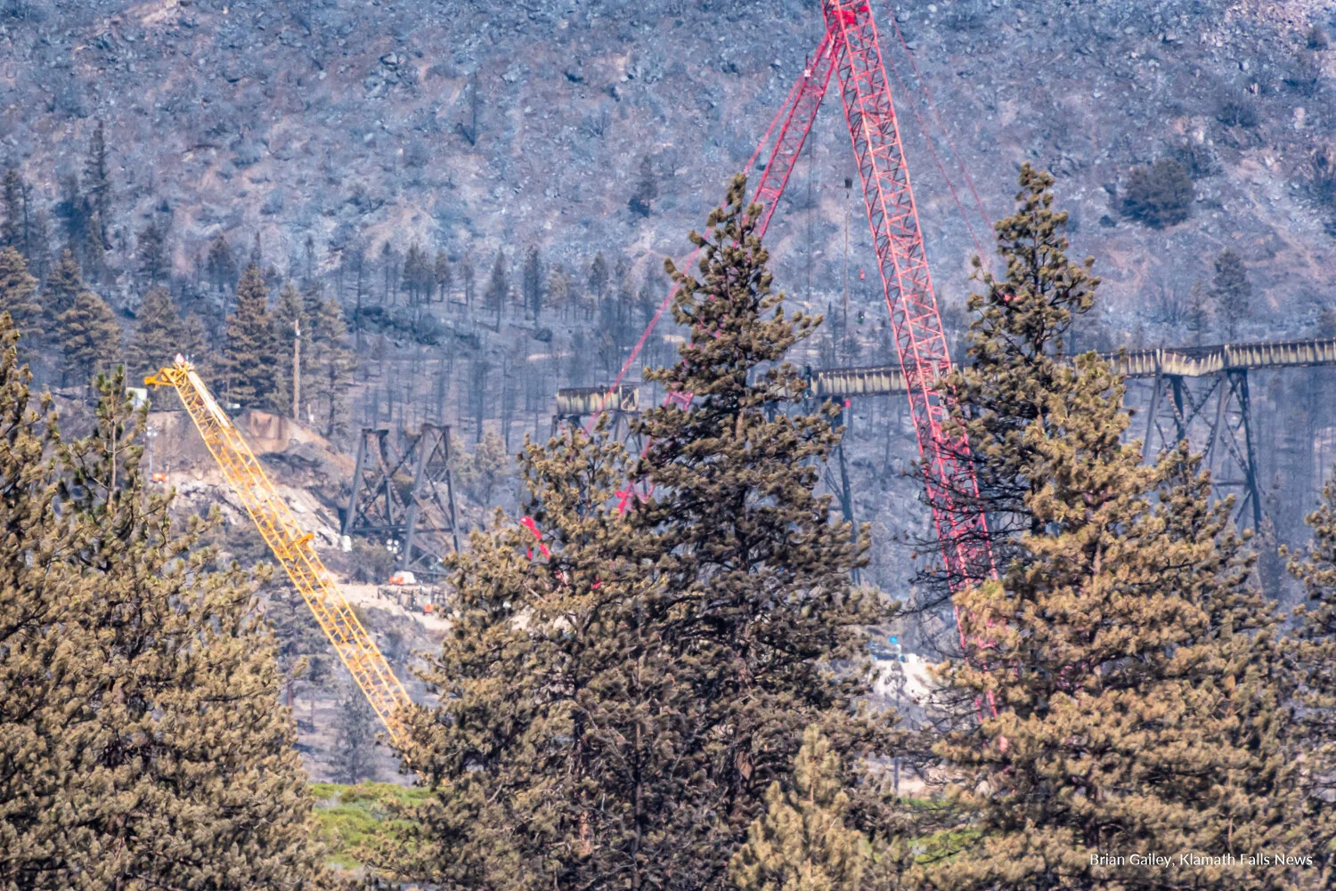 Union Pacific’s Dry Creek Bridge on their highly-trafficked rail line at the base of Mt. Shasta has been significantly damaged thanks to the 25,000-acre lightning-sparked Lava Fire. There is no estimated time as to when the line will reopen. July 6, 2021. (Image: Brian Gailey, Klamath Falls News)