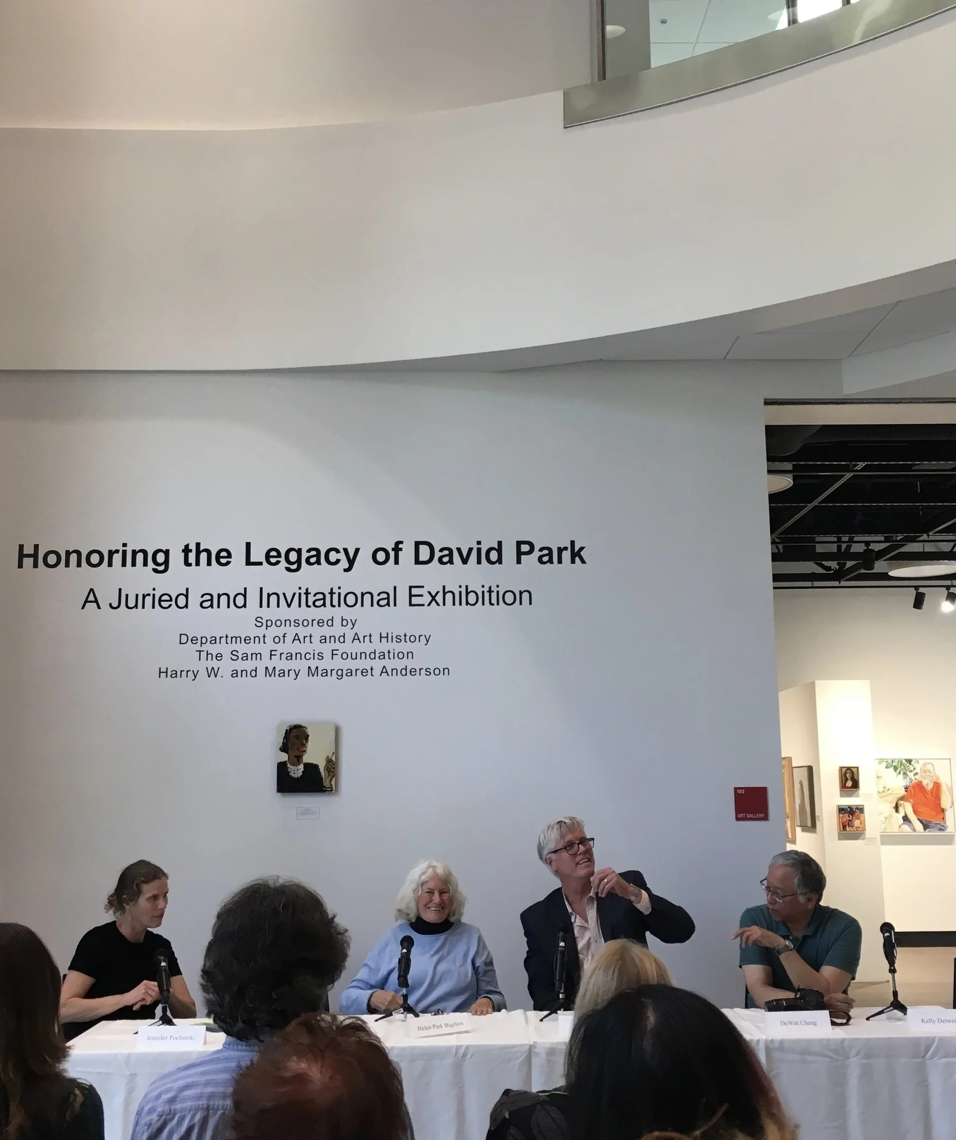 Opening Reception Panel discussion. The artist's work "Asbury Surf: The Close Up" is on the vertical column inside the gallery on the right.