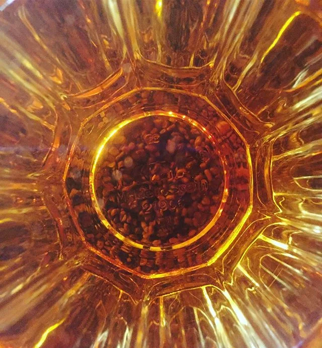 Peering into the depths of a cup of &lsquo;kuti&rsquo; or Ethiopian coffee-leaf tea. That&rsquo;s right, tea brewed from the leaves of arabica coffee plants. A bit grassy with light menthol notes. Perfect for washing down some injera but can&rsquo;t 