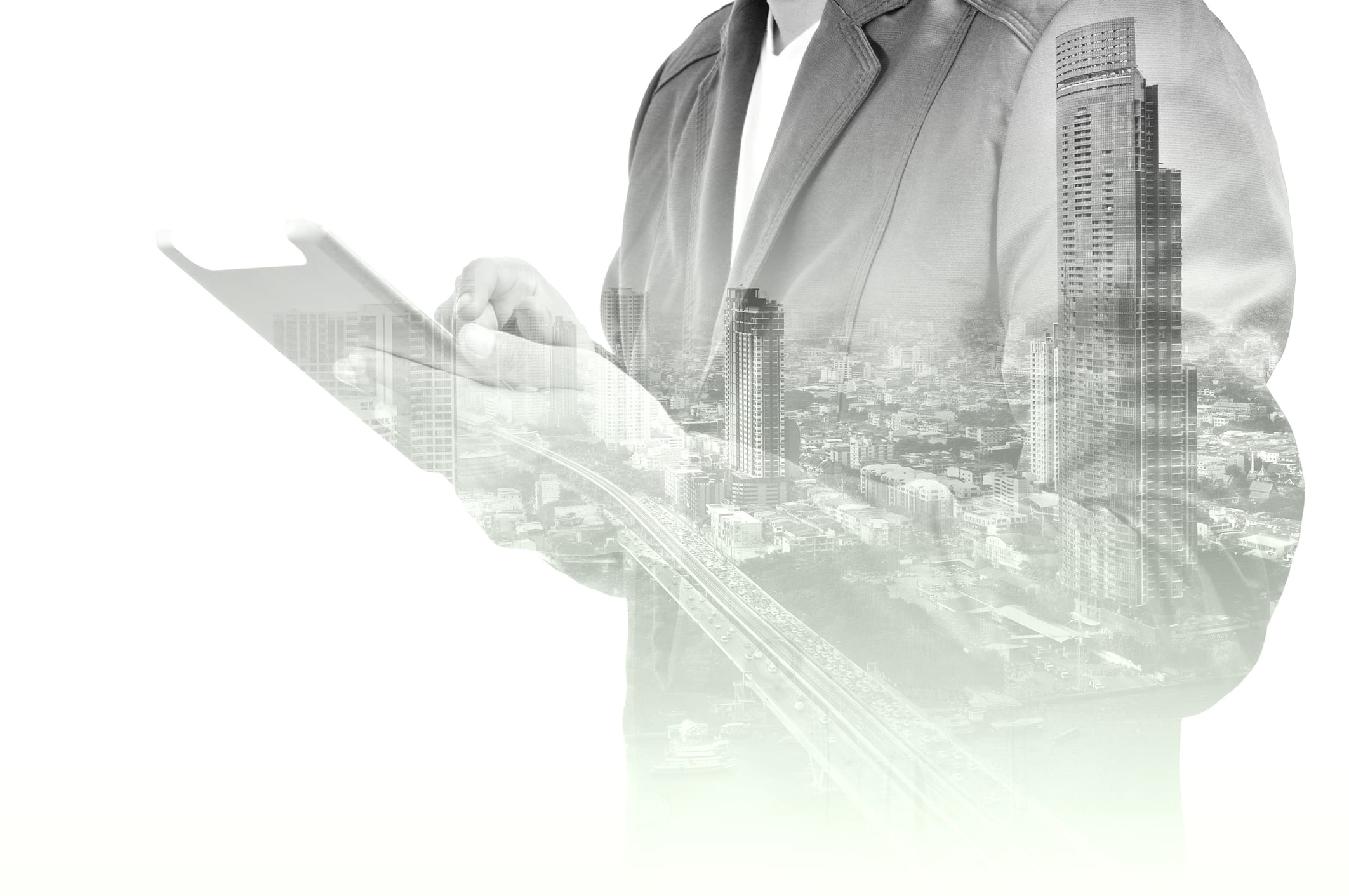 Double-exposure-of-city-and-Businessman-use-Tablet-device-505968136_2128x1413.jpeg