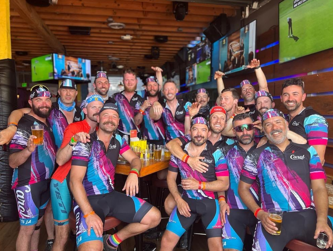 Team carol, 20 guys wearing bike kits, at High Tops in LA
