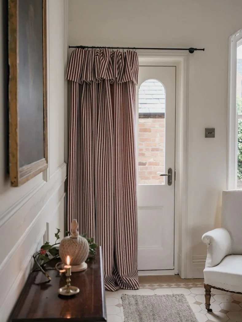 Keep the January drafts out and consider something as practical as it is beautiful with @torimurphytextiles&rsquo; ready-made door curtains. 
 
This striped beauty is made with merino wool and is finished with a thermal lining for extra warmth, ava