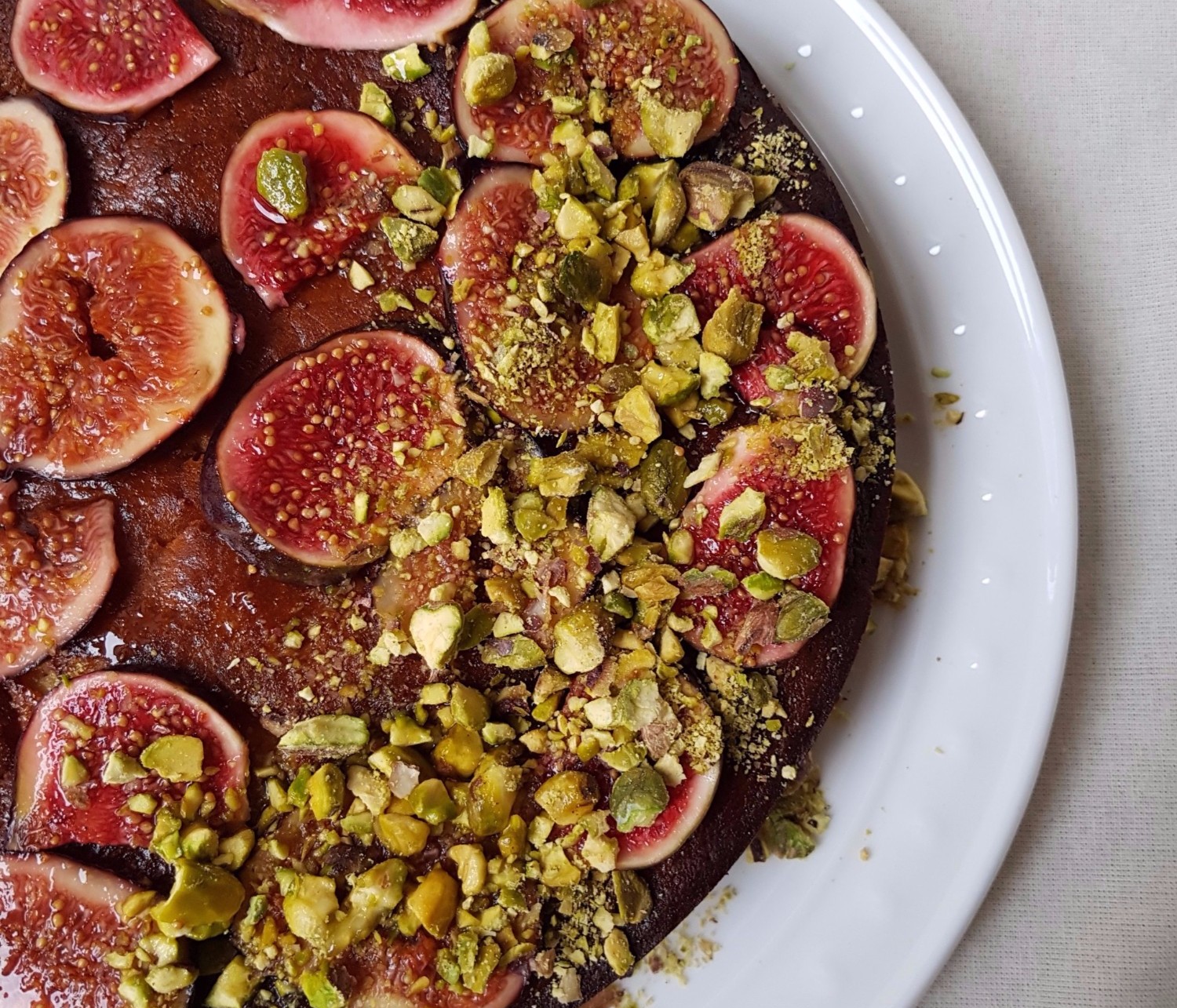 close-up-yogurt-an-olive-oil-cake-pistachios-figs.jpg
